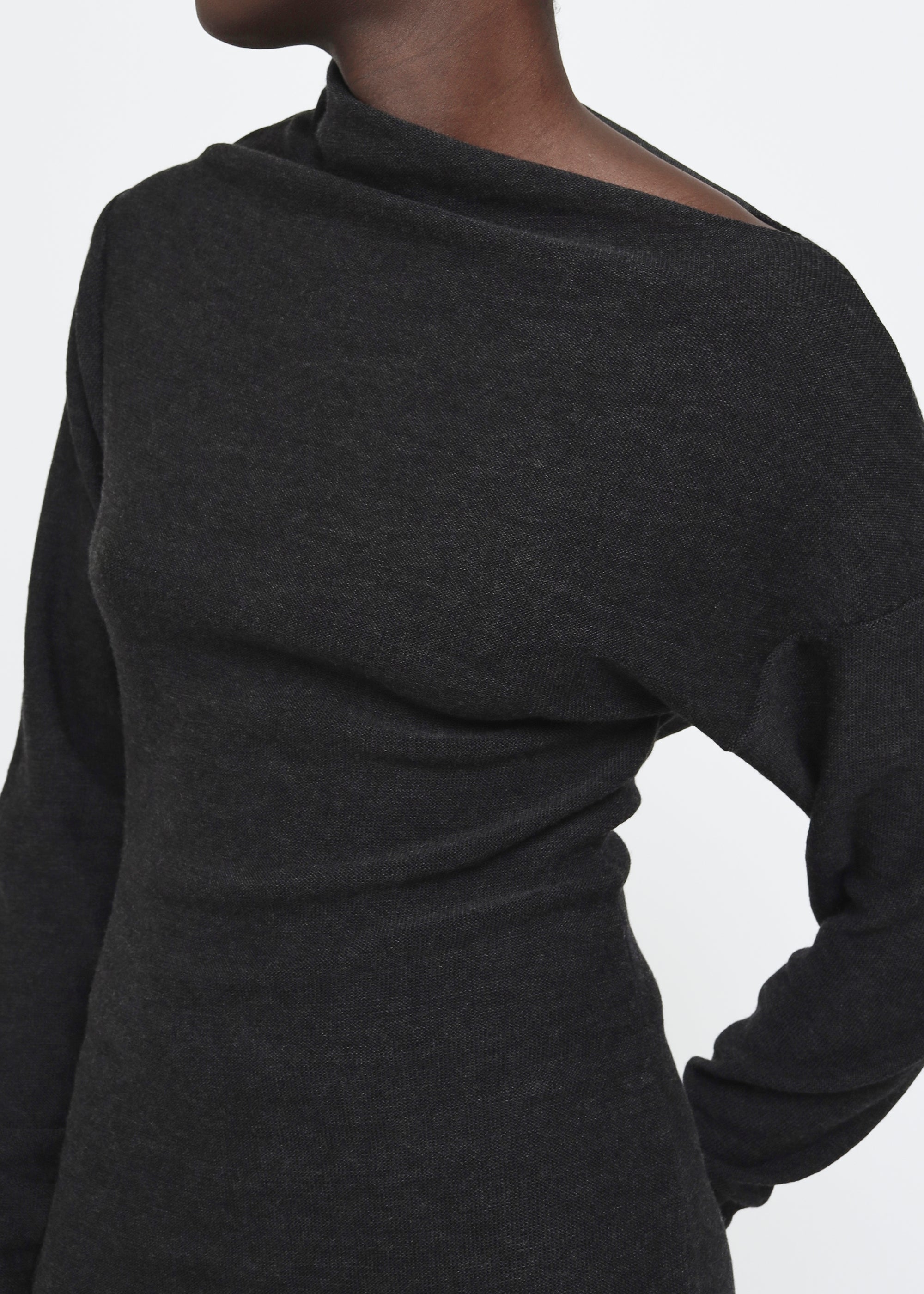 A dark gray knitted long-sleeve asymmetric mock neck midi dress.