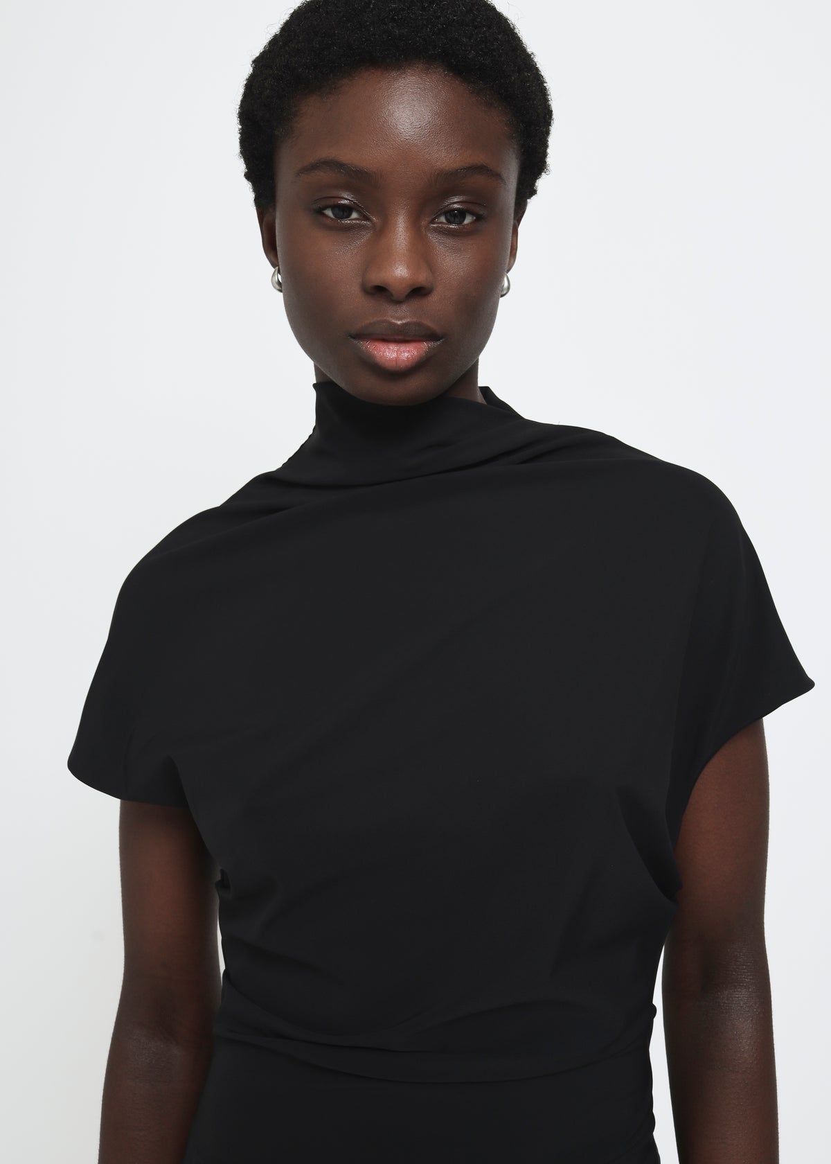 Black cap-sleeve ankle-length dress with a high mock neckline and soft waist folds