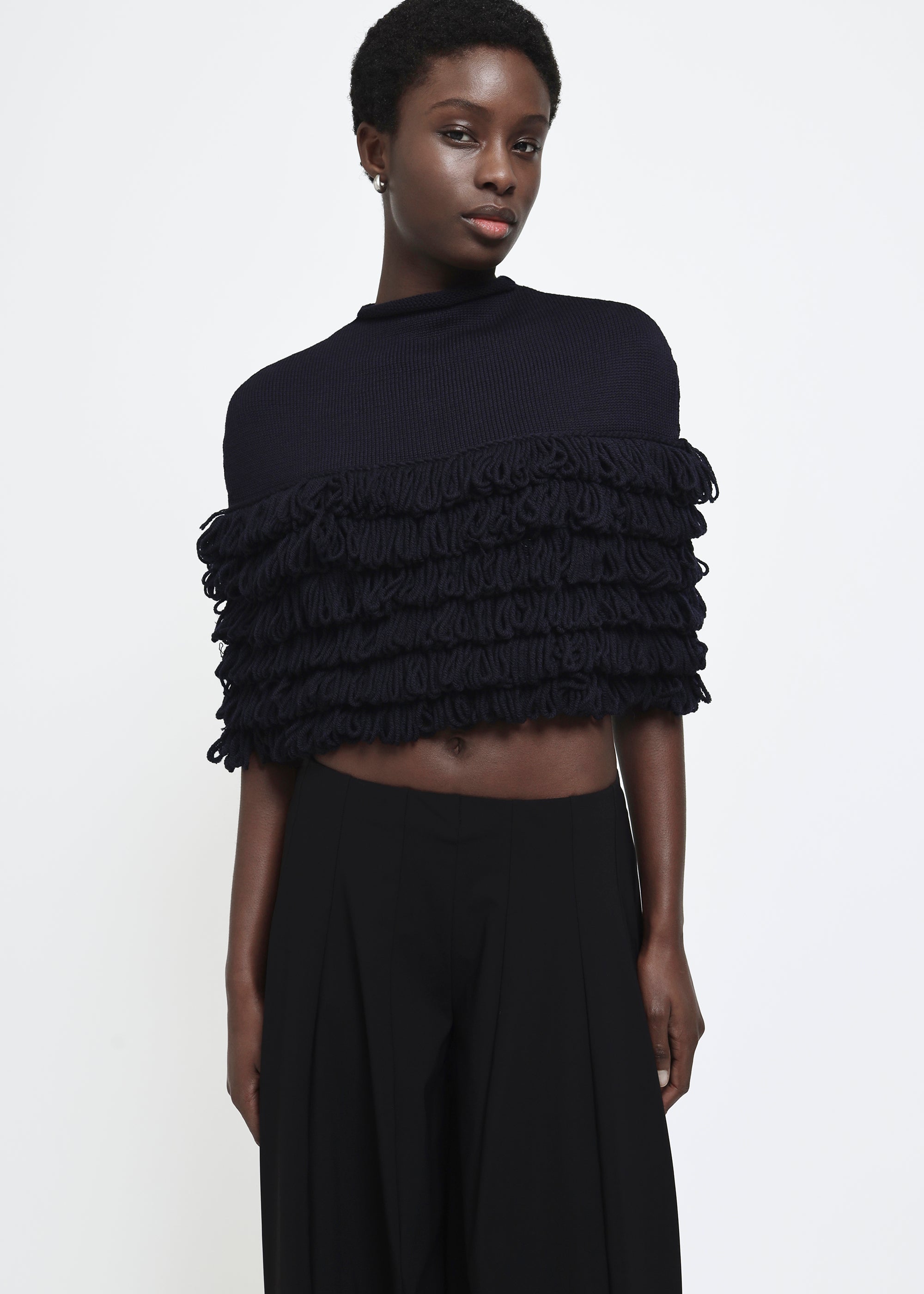 A navy hand-looped tiered fringe wool cape.