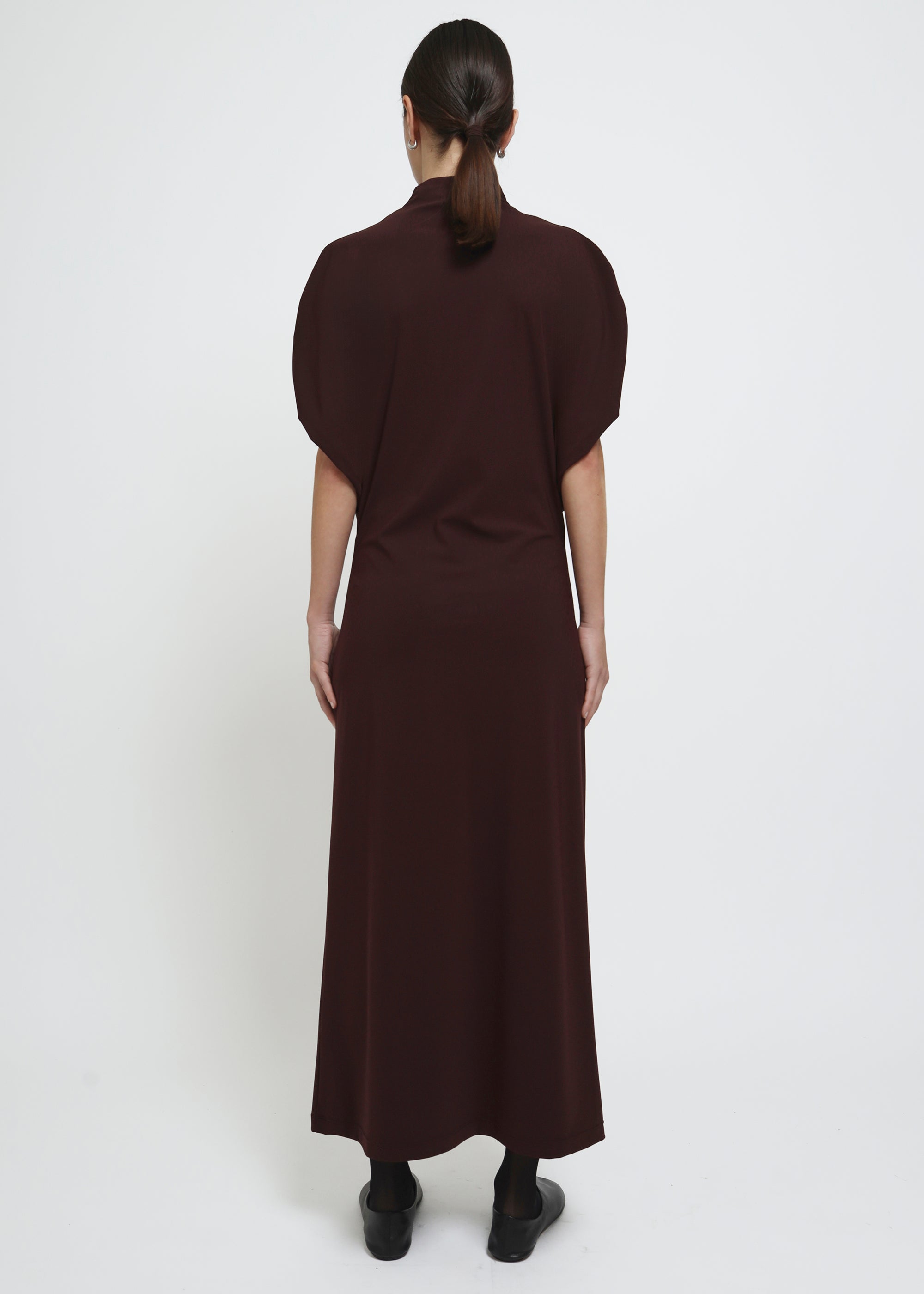 A dark brown red mock-neck dress with short puff sleeves.