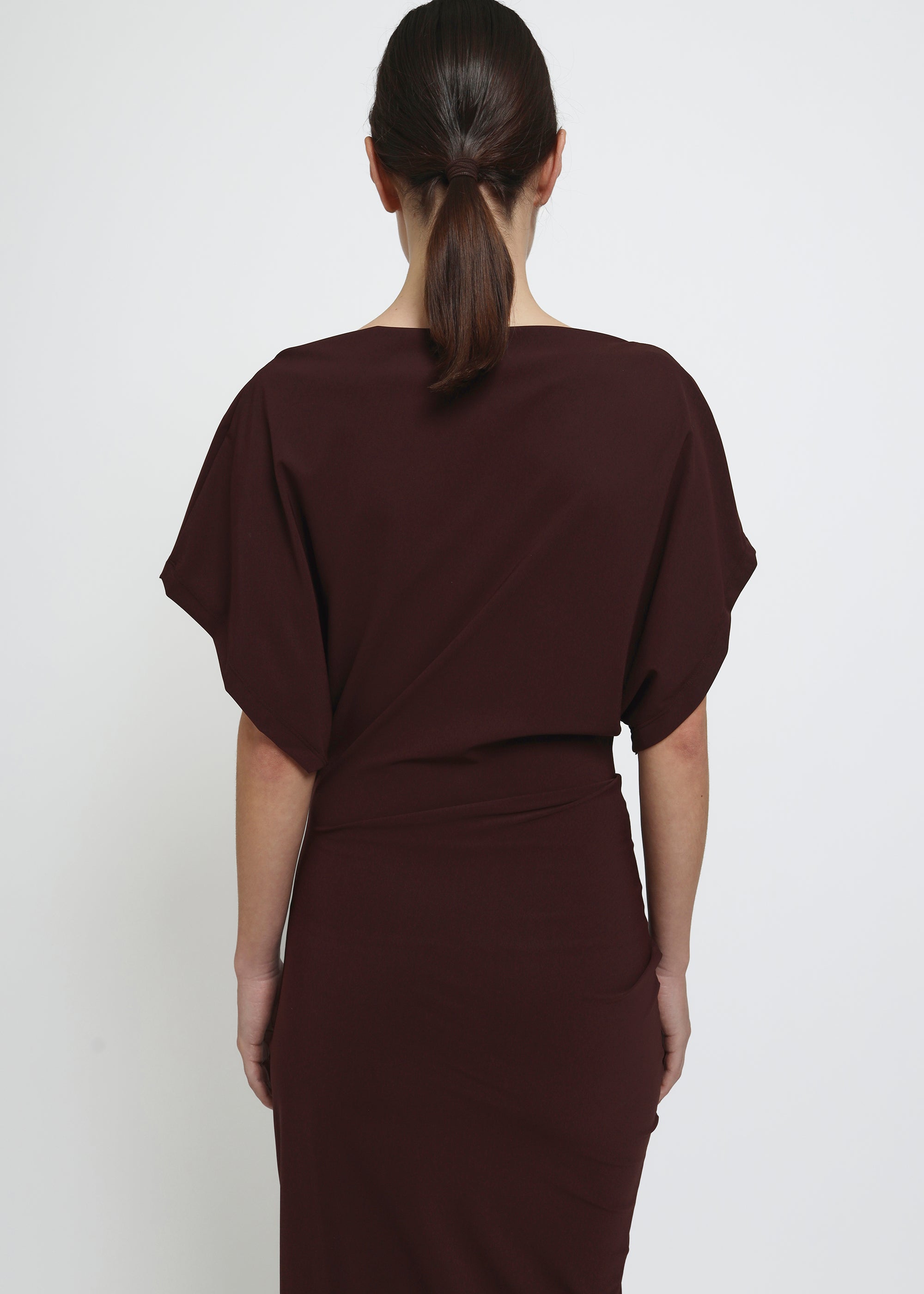 A dark red midi dress with draped short sleeves and a gathered waist.
