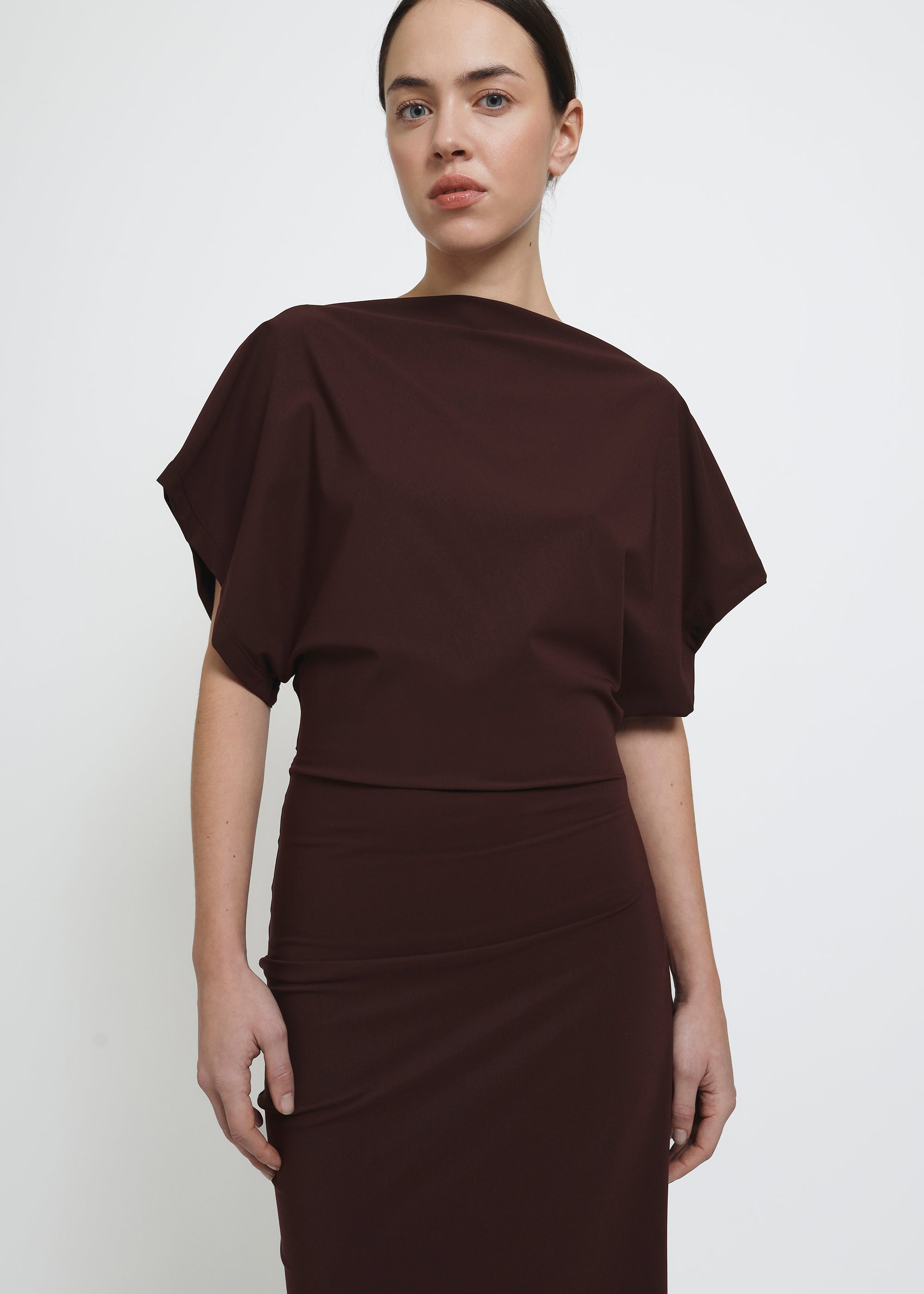 A dark red midi dress with draped short sleeves and a gathered waist.