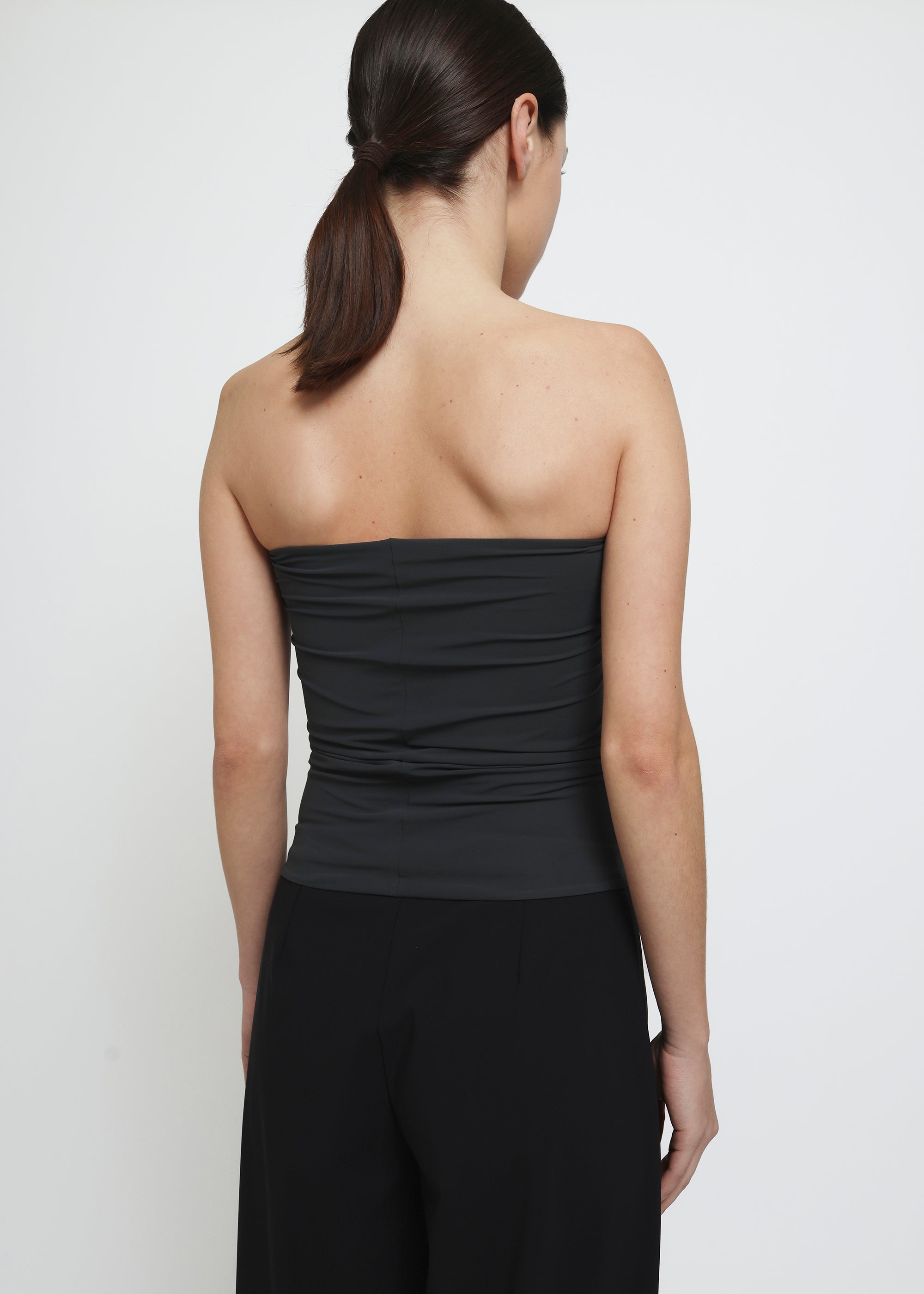 A dark gray strapless tube top.