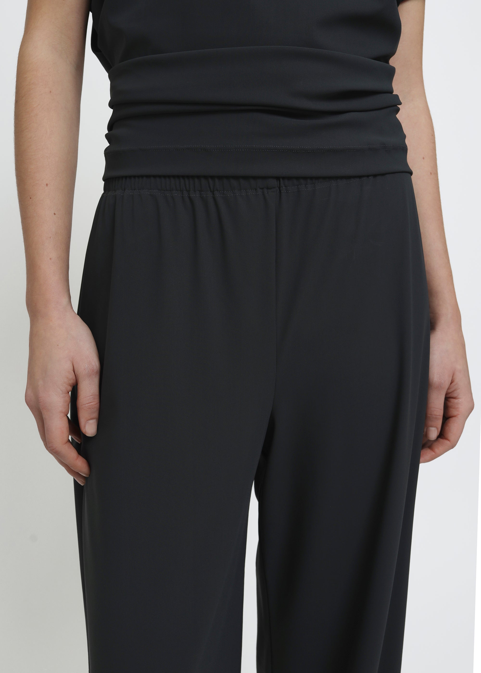 Dark grey wide legged pull on pants.