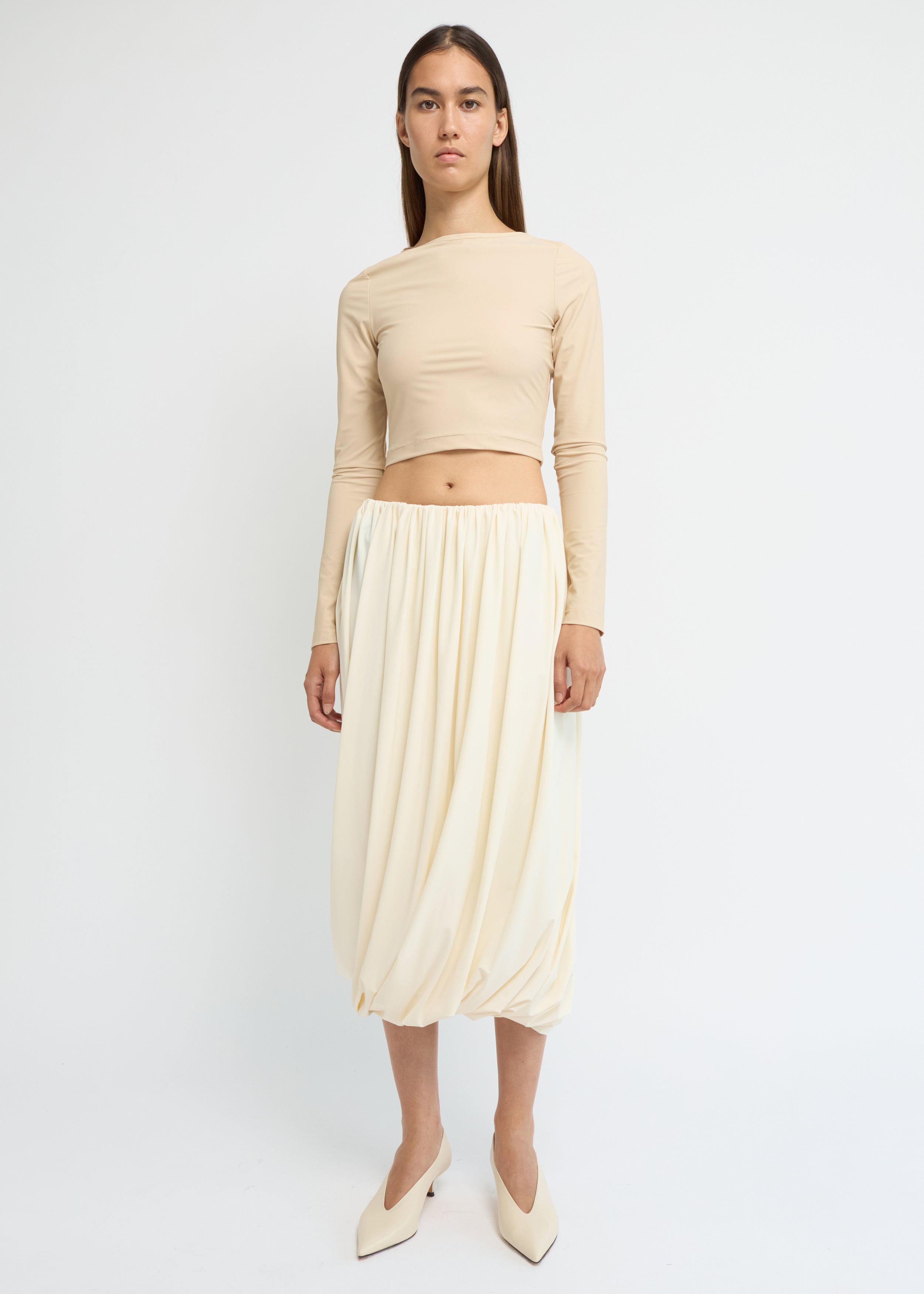 Cream balloon midi skirt with a voluminous, gathered silhouette