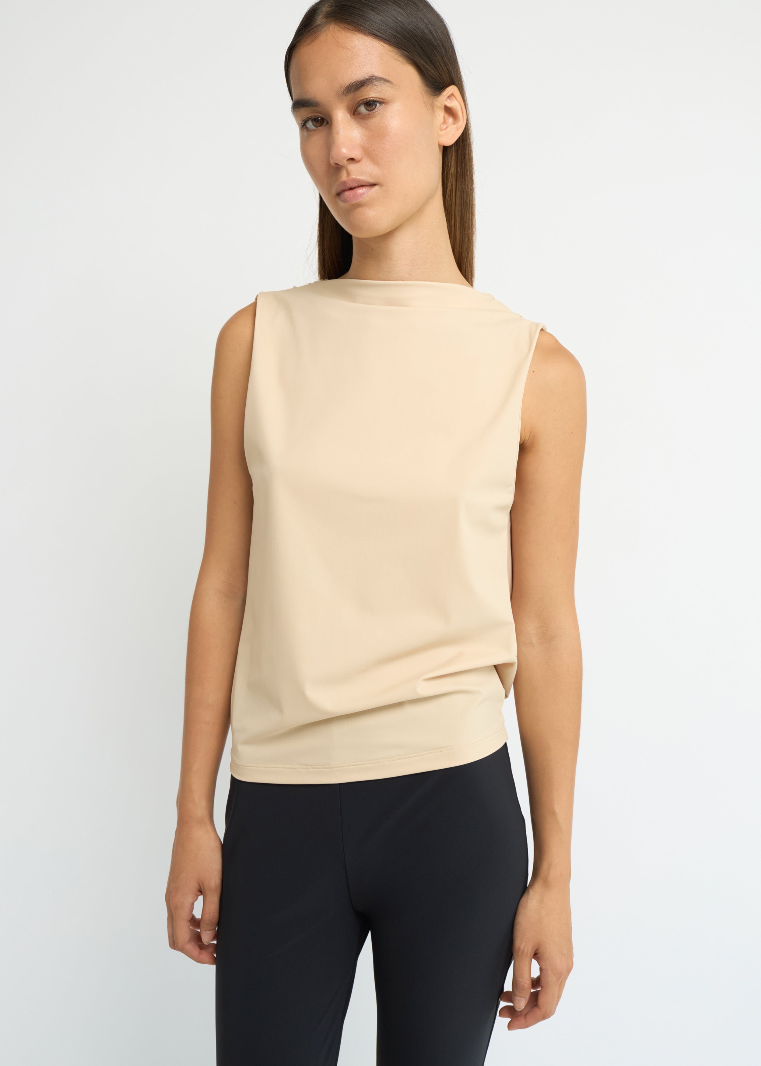 Sand sleeveless top with a high neckline and open back