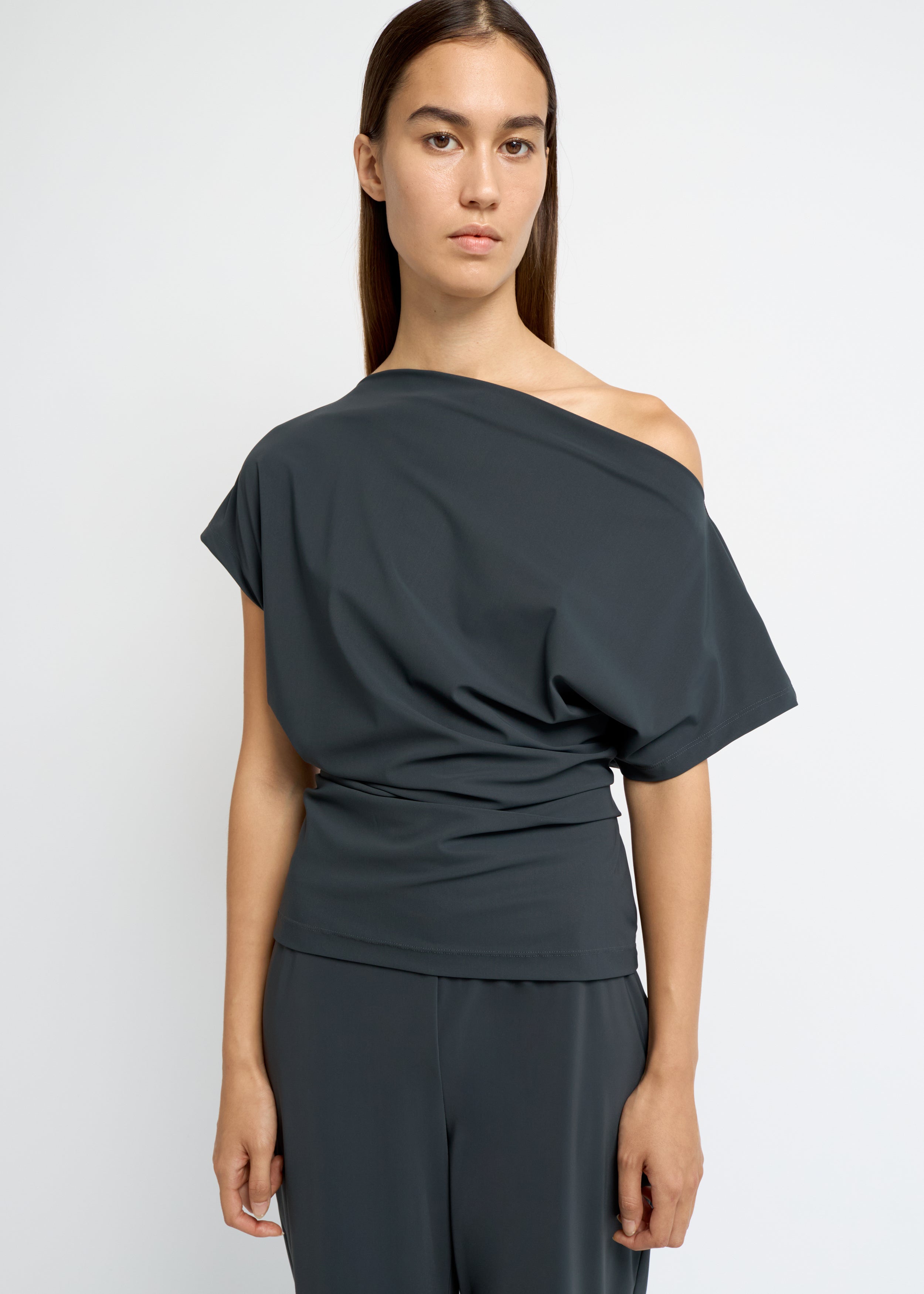 Charcoal off-shoulder draped top with soft waist gathering