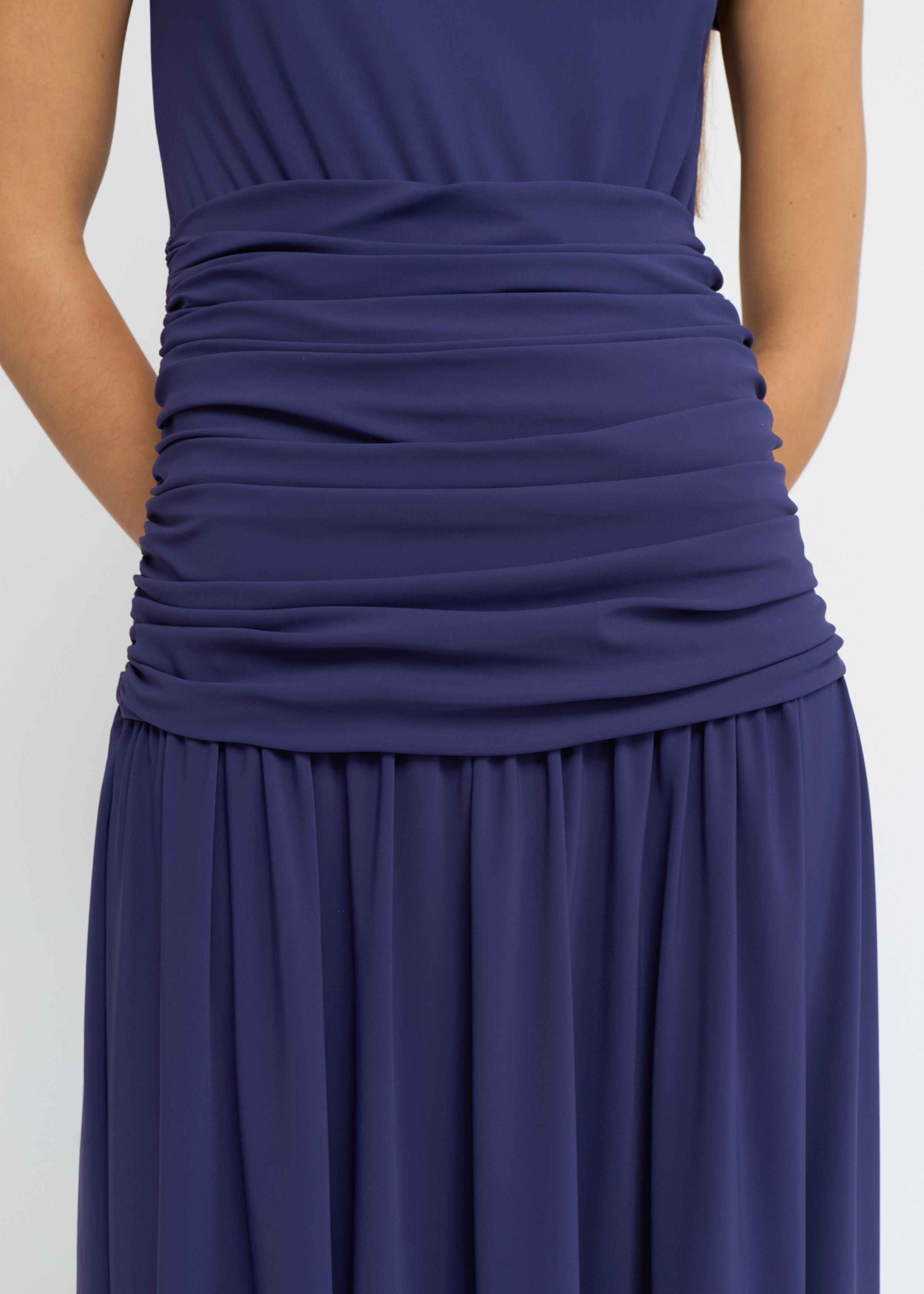 Violet ankle-length dress with cap sleeves, high neckline and softly gathered waist
