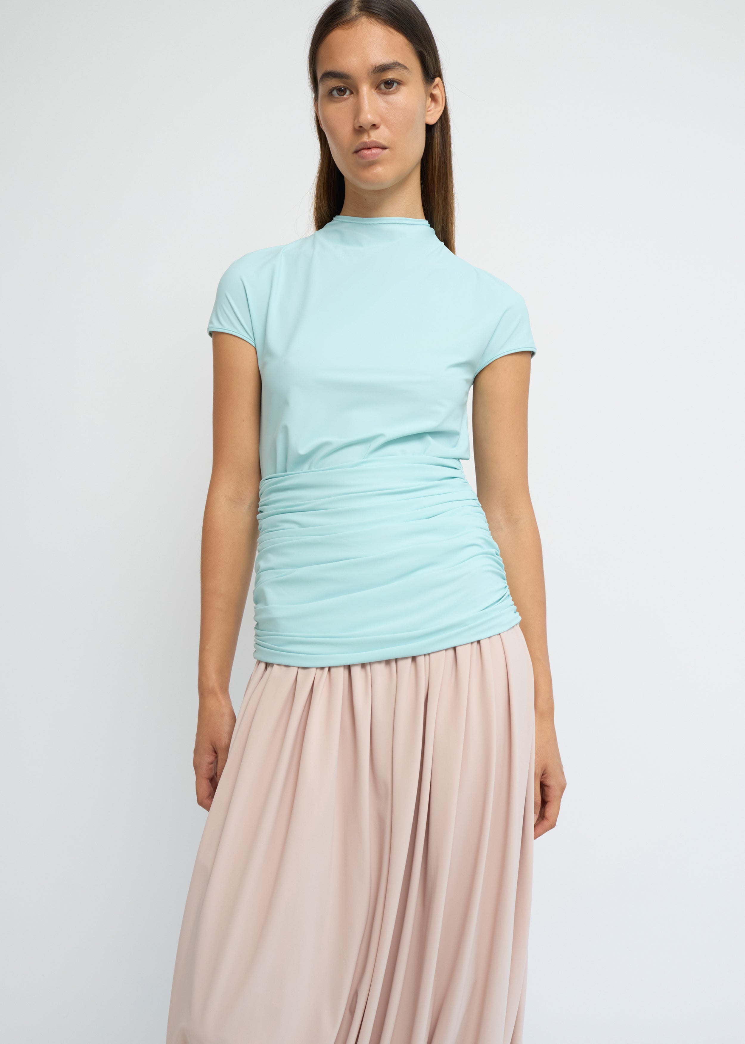 Sky fitted short-sleeve top with a high neckline and soft gathers at the waist
