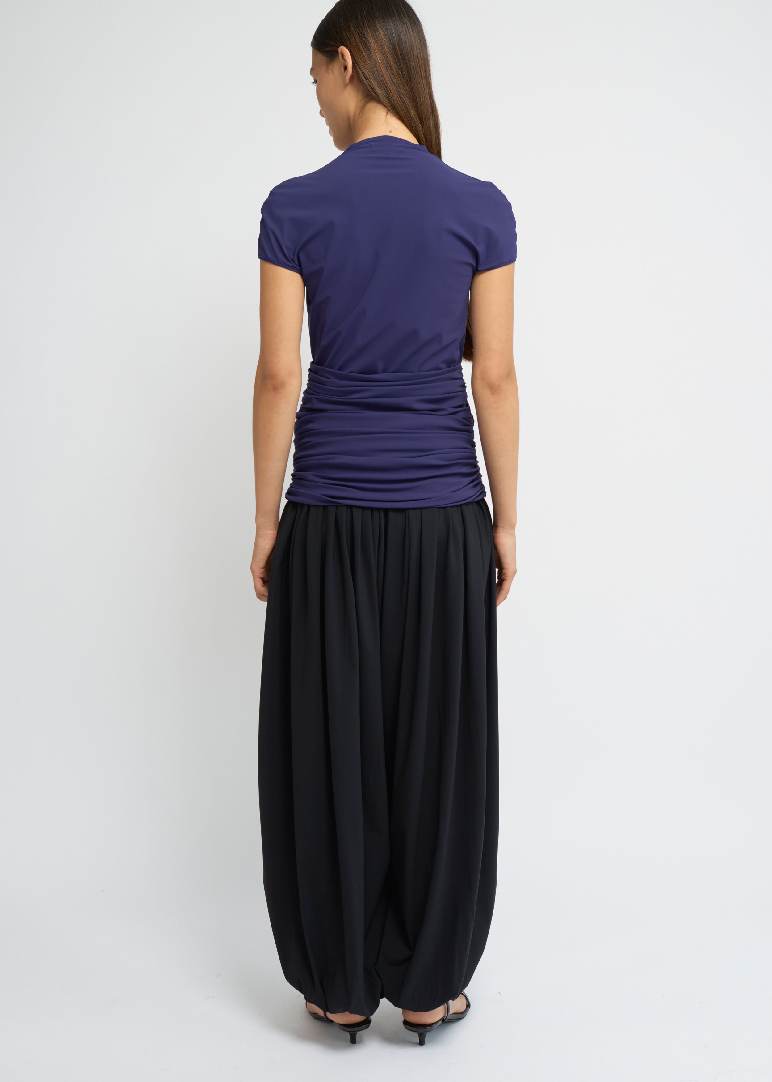Violet fitted short-sleeve top with a high neckline and soft gathers at the waist