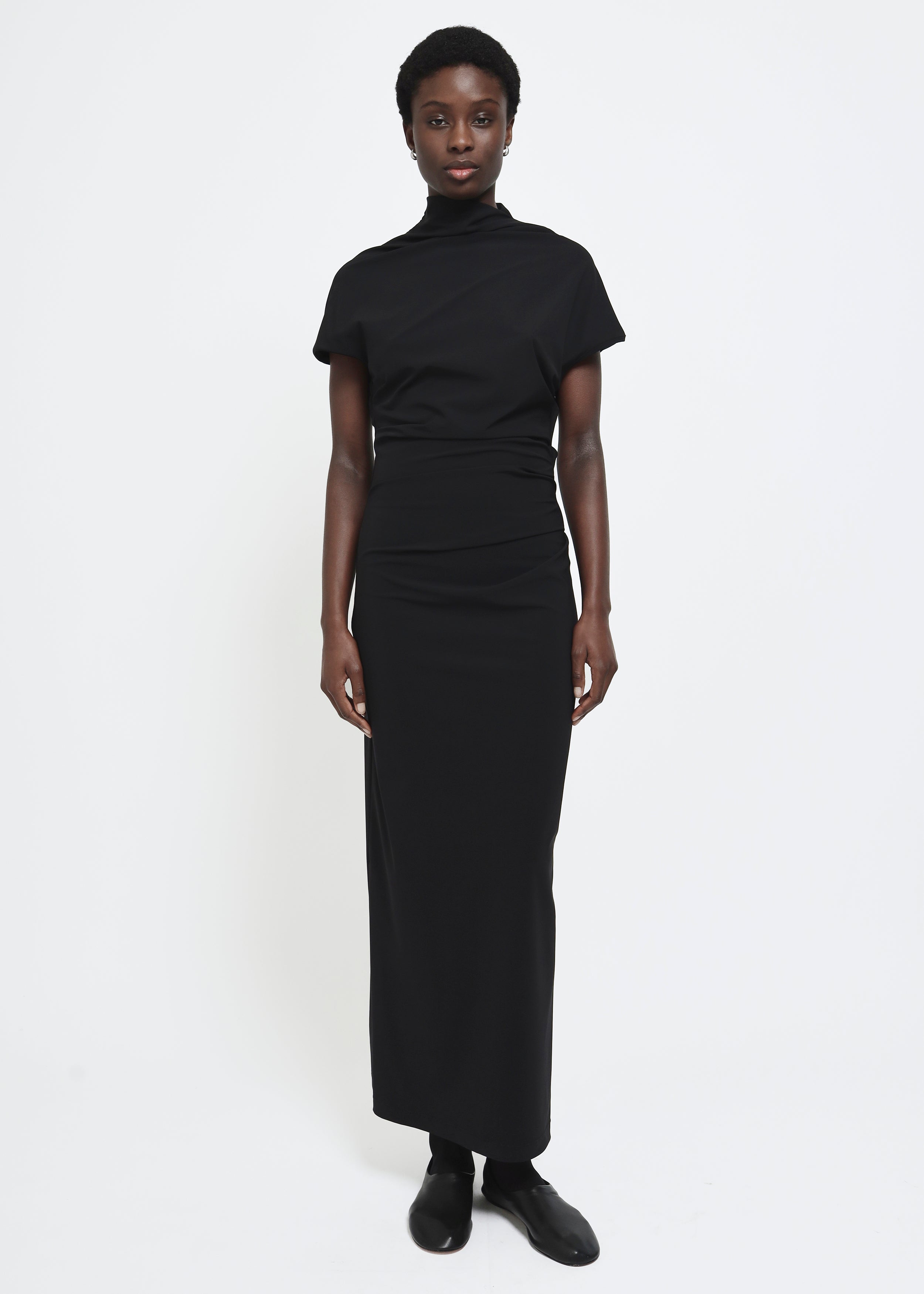 Black cap-sleeve ankle-length dress with a high mock neckline and soft waist folds