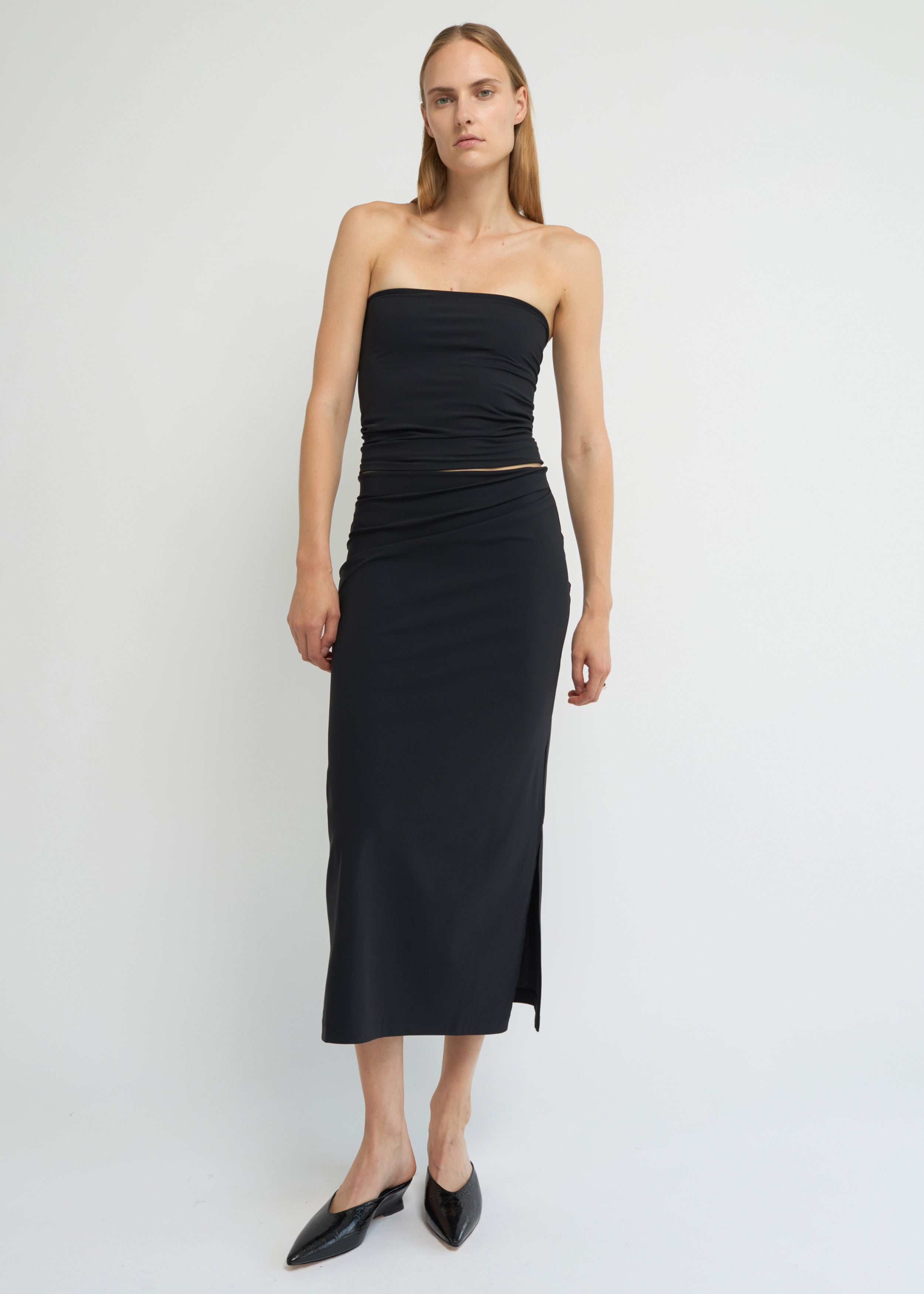 Black midi skirt with side split and straight silhouette