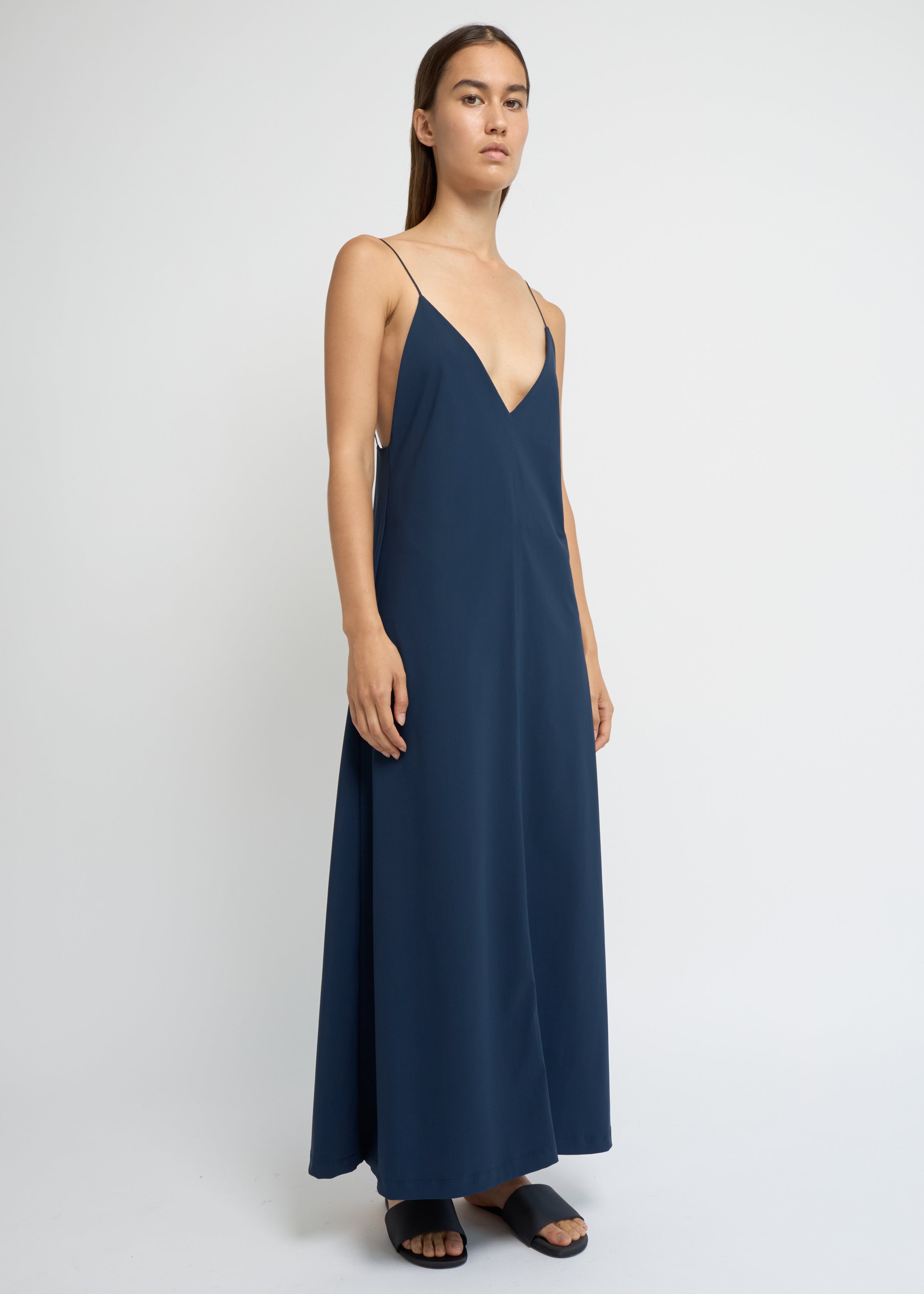 Ink slip dress with a deep V-neckline and fluid, ankle-length silhouette