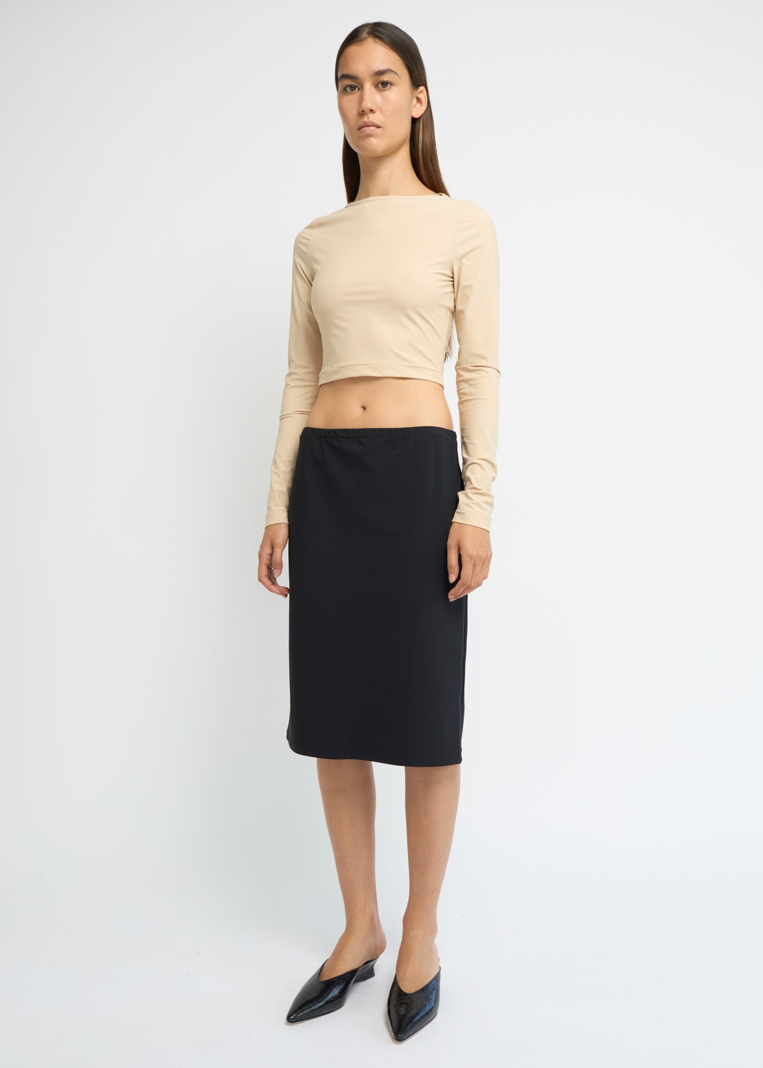 Black straight-fit midi skirt with a clean, minimal silhouette