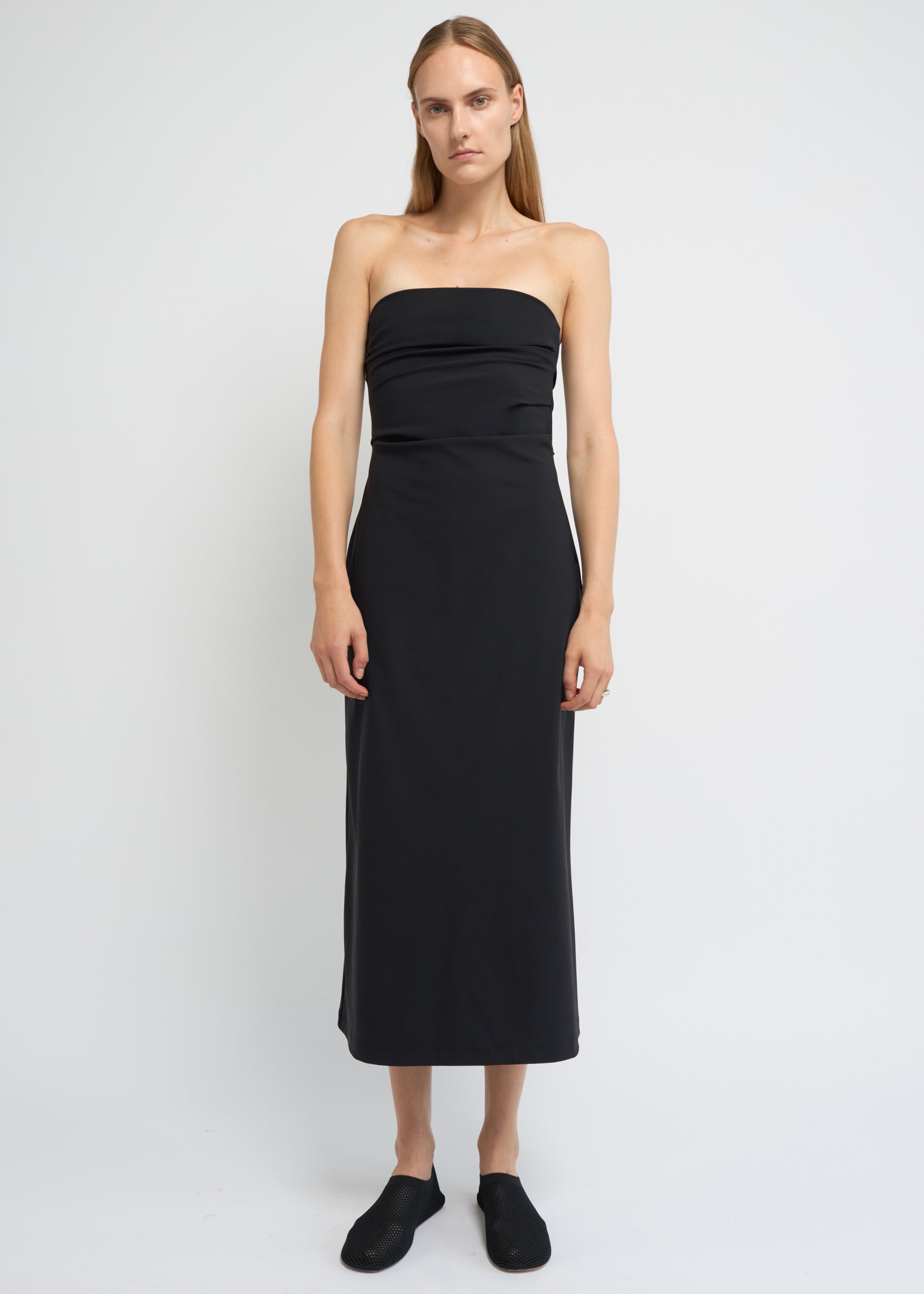 Black strapless midi dress with a structured A-line shape