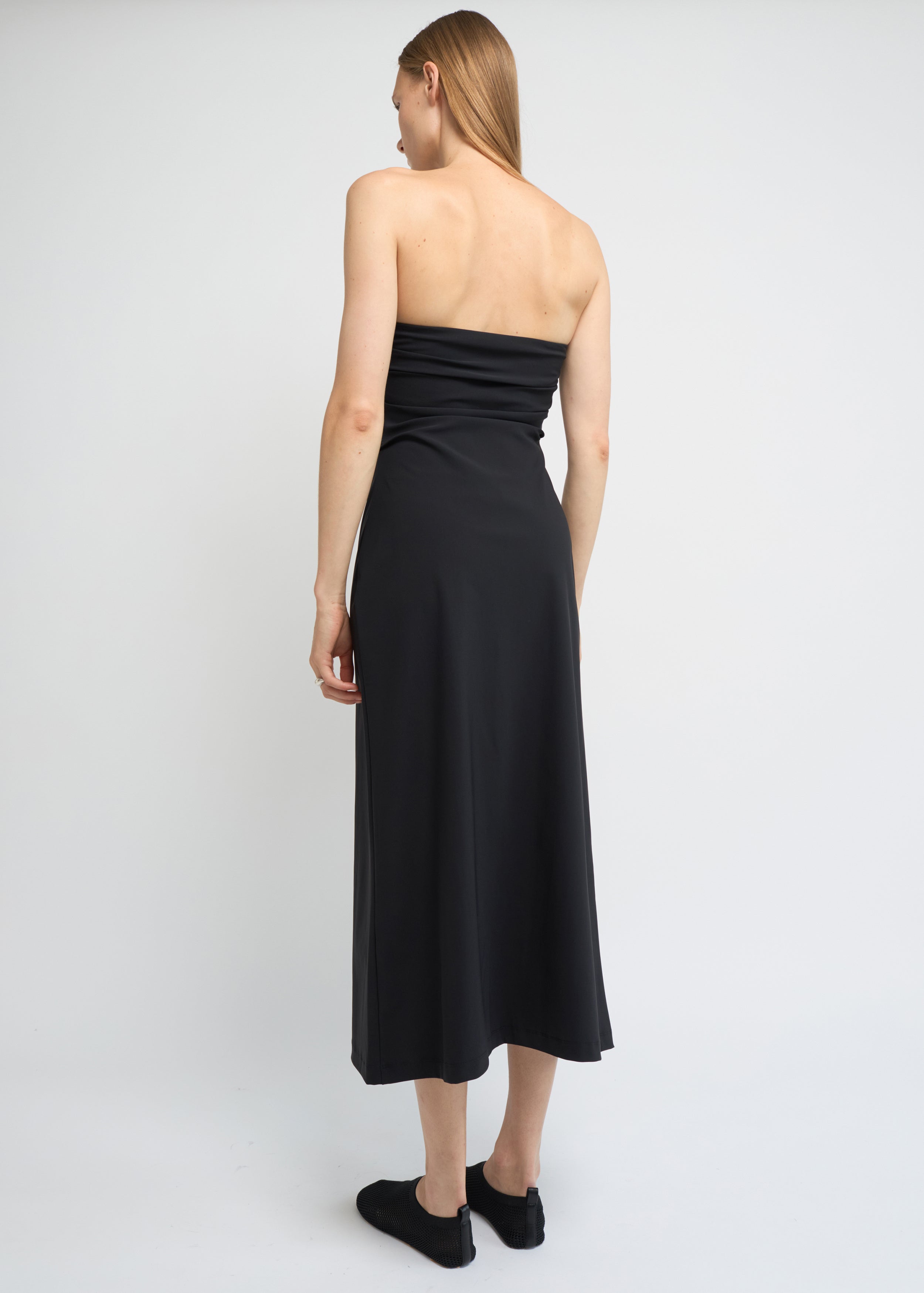 Black strapless midi dress with a structured A-line shape