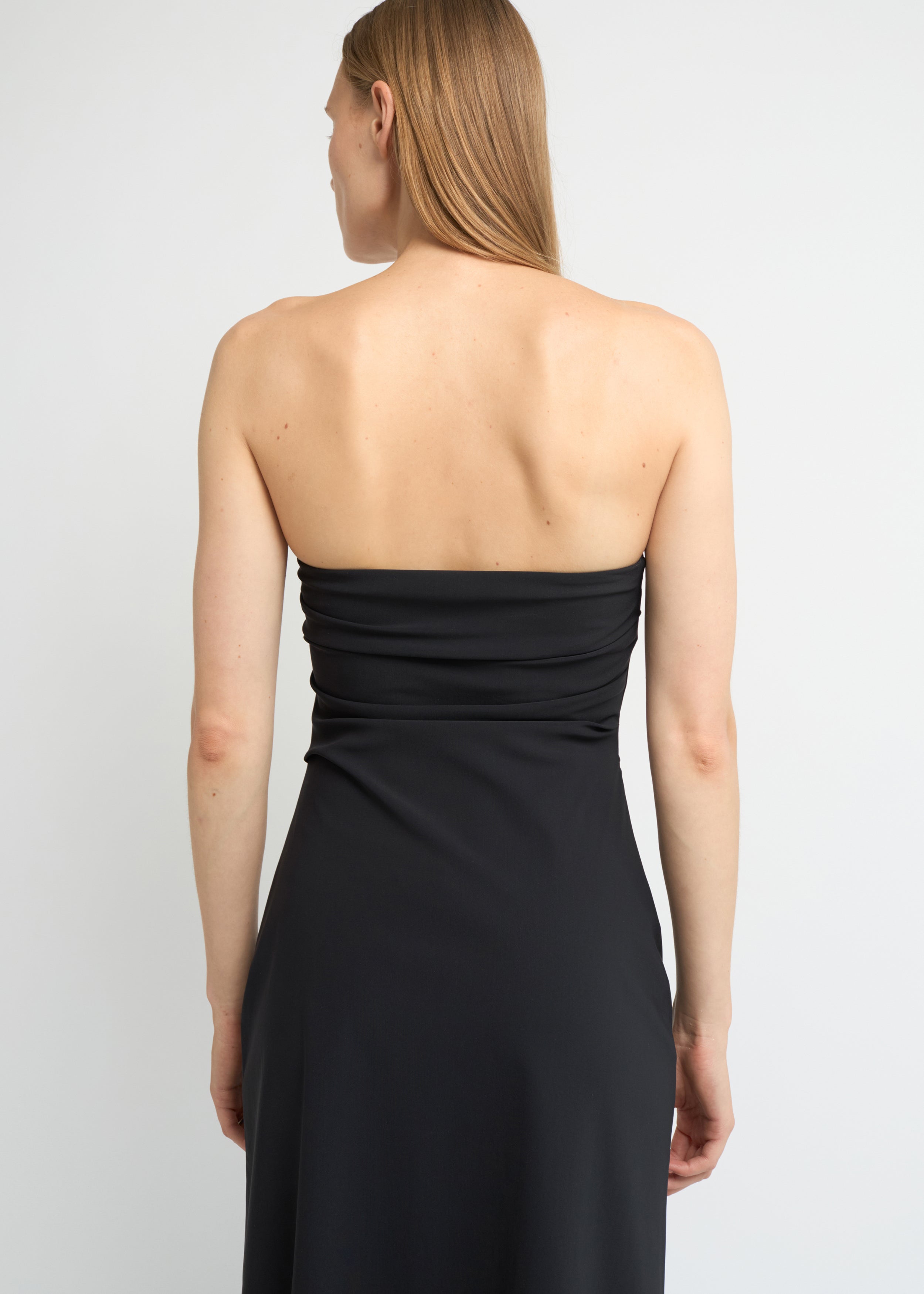 Black strapless midi dress with a structured A-line shape
