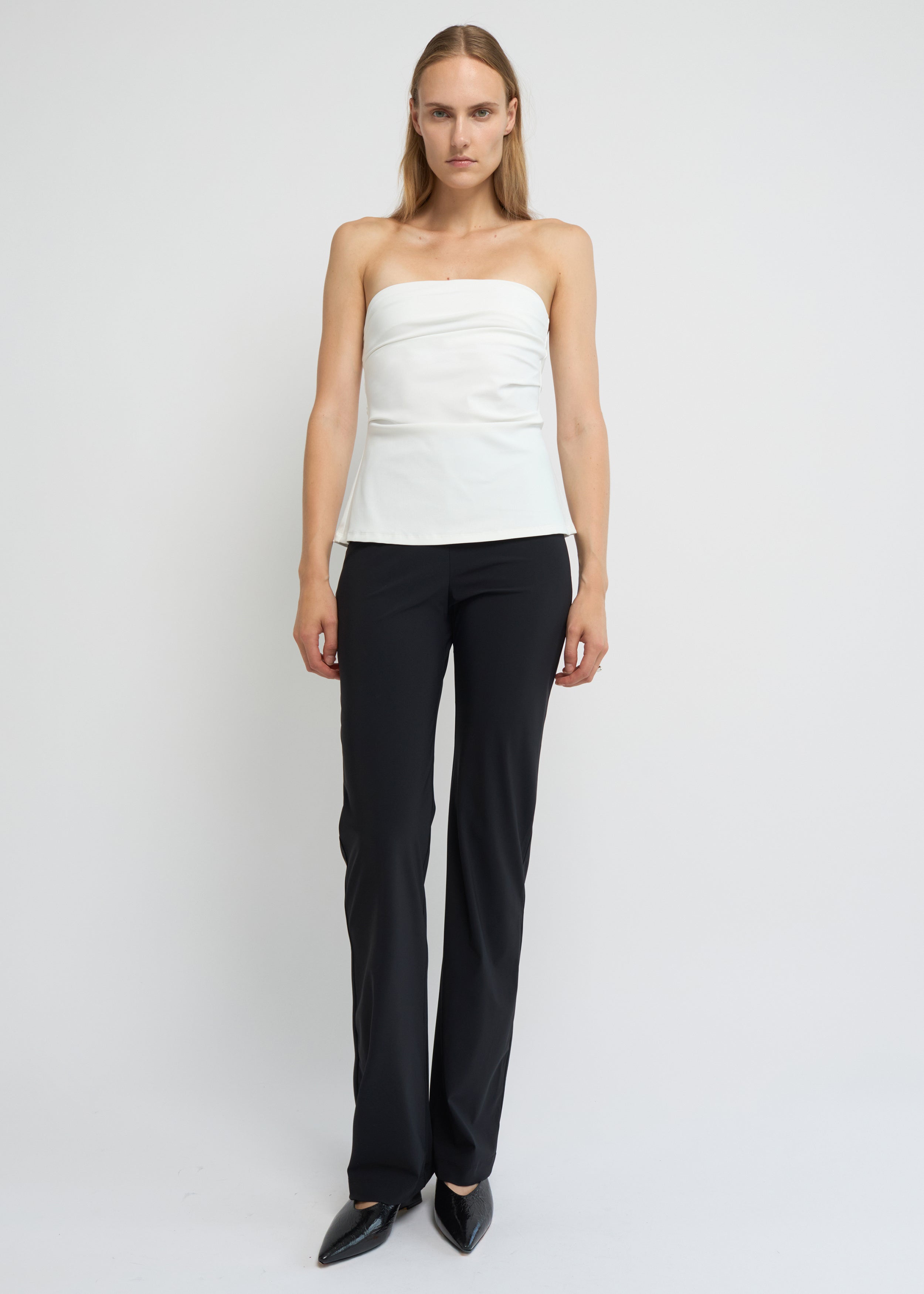 Off-white strapless A-line top with clean neckline and flared hem