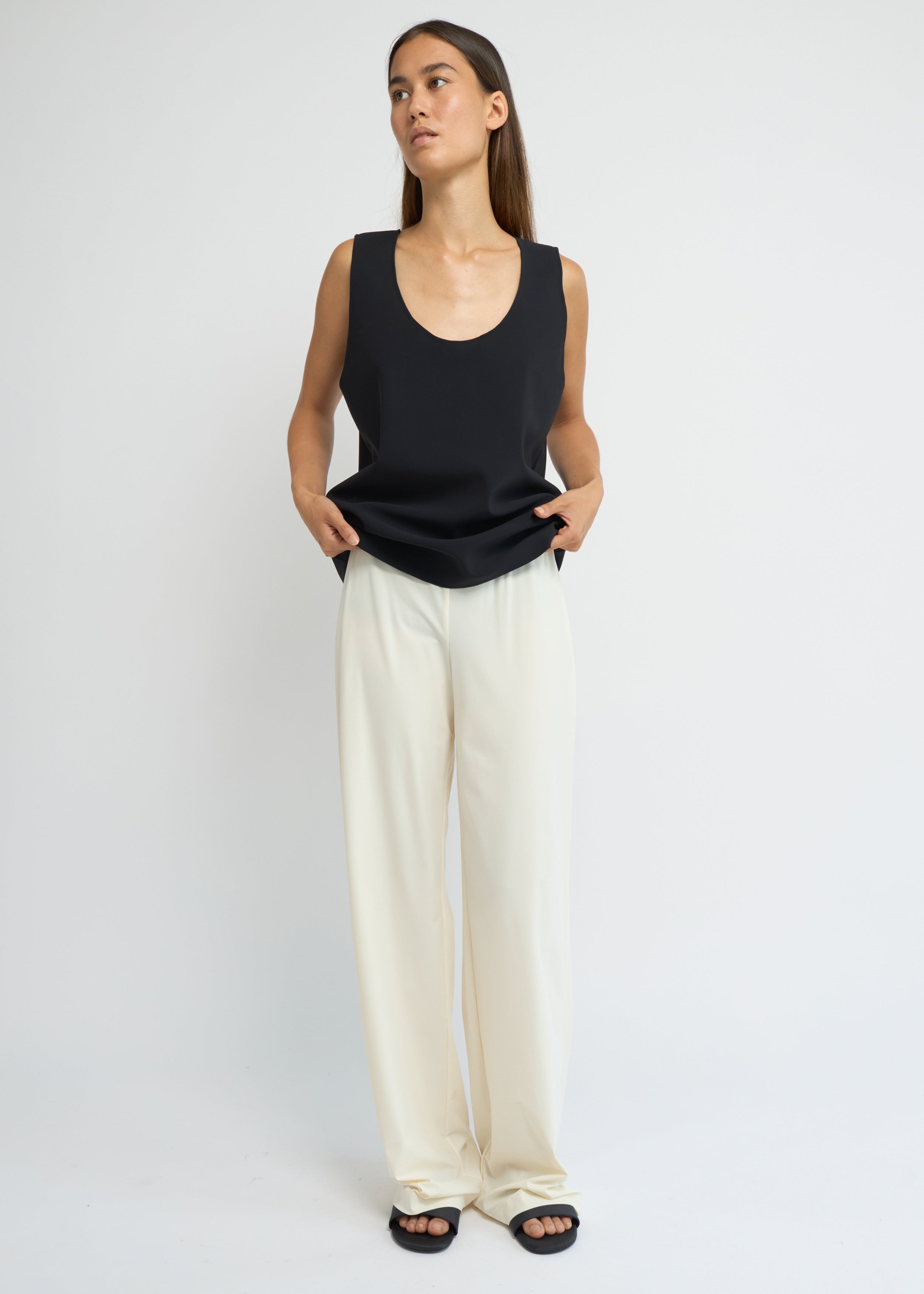 Cream wide-leg jersey pants with a fluid silhouette and elasticated waistband