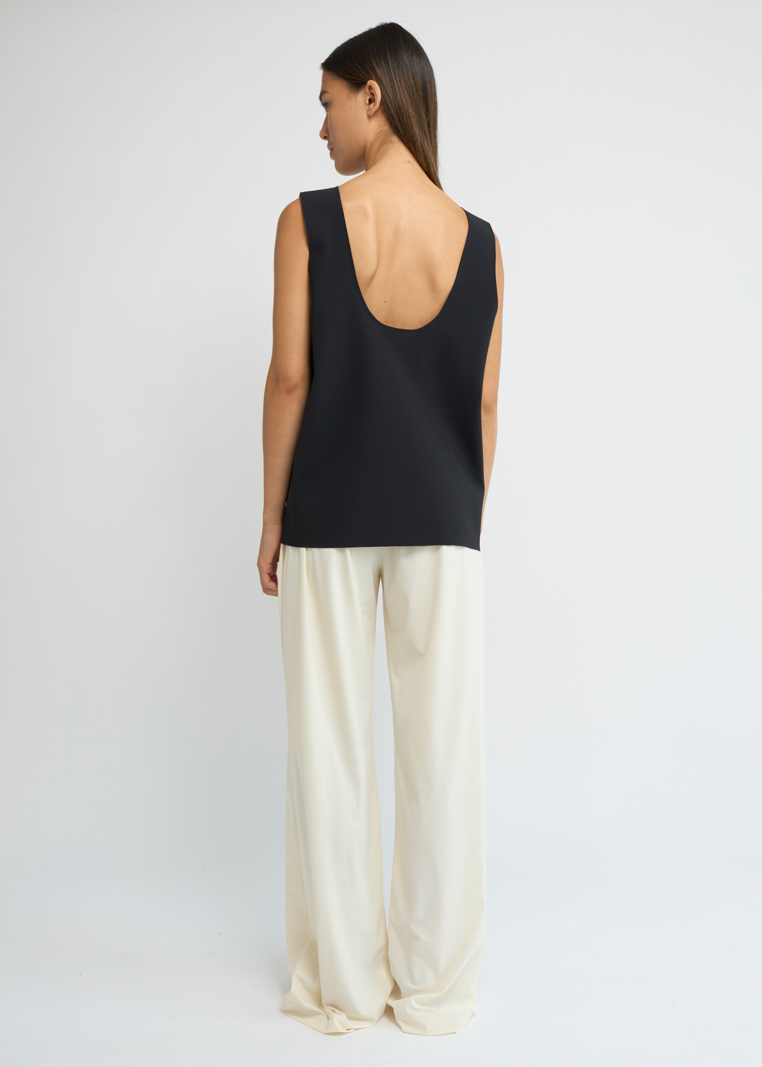 Cream wide-leg jersey pants with a fluid silhouette and elasticated waistband