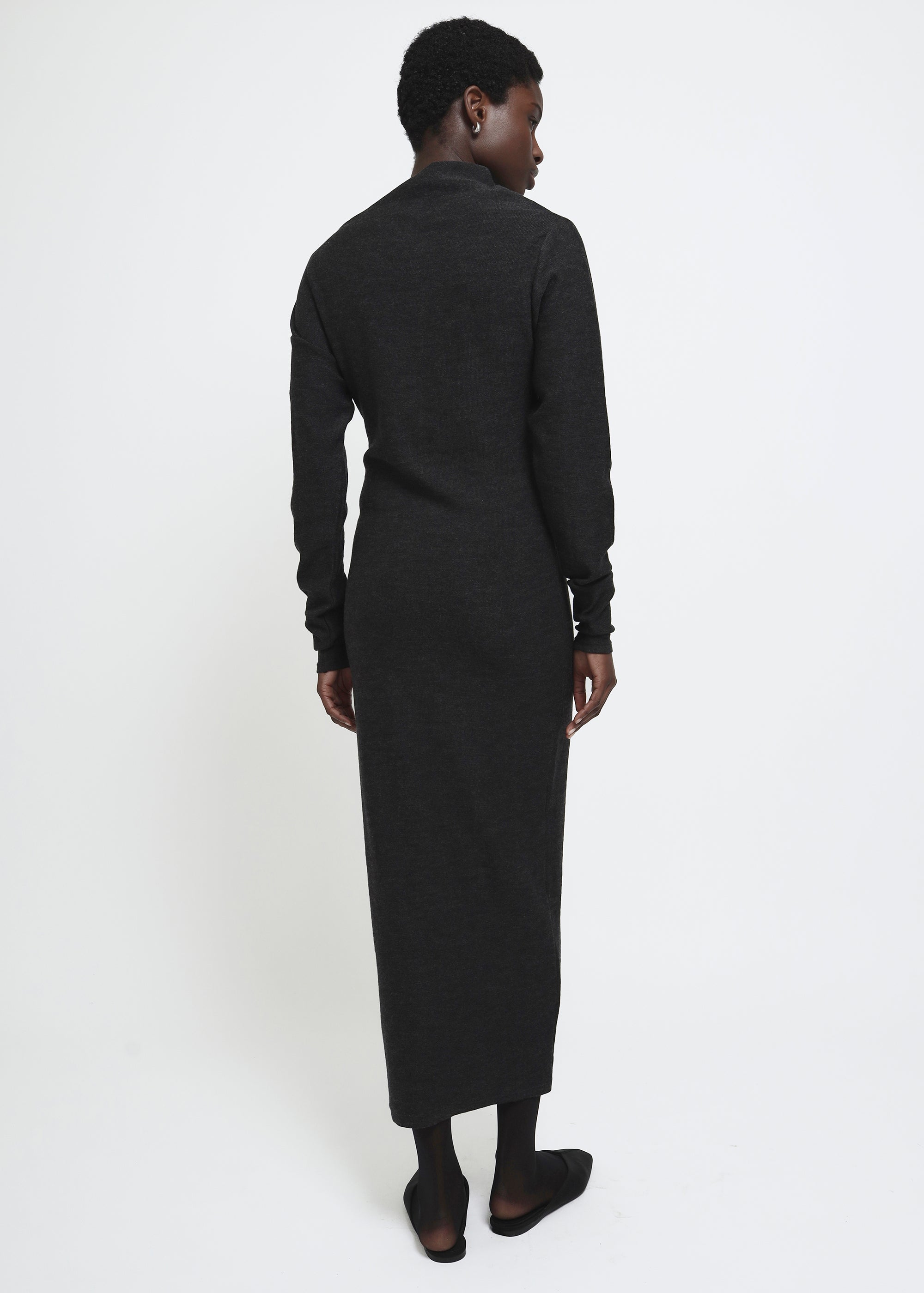 A dark gray knitted long-sleeve asymmetric mock neck midi dress.