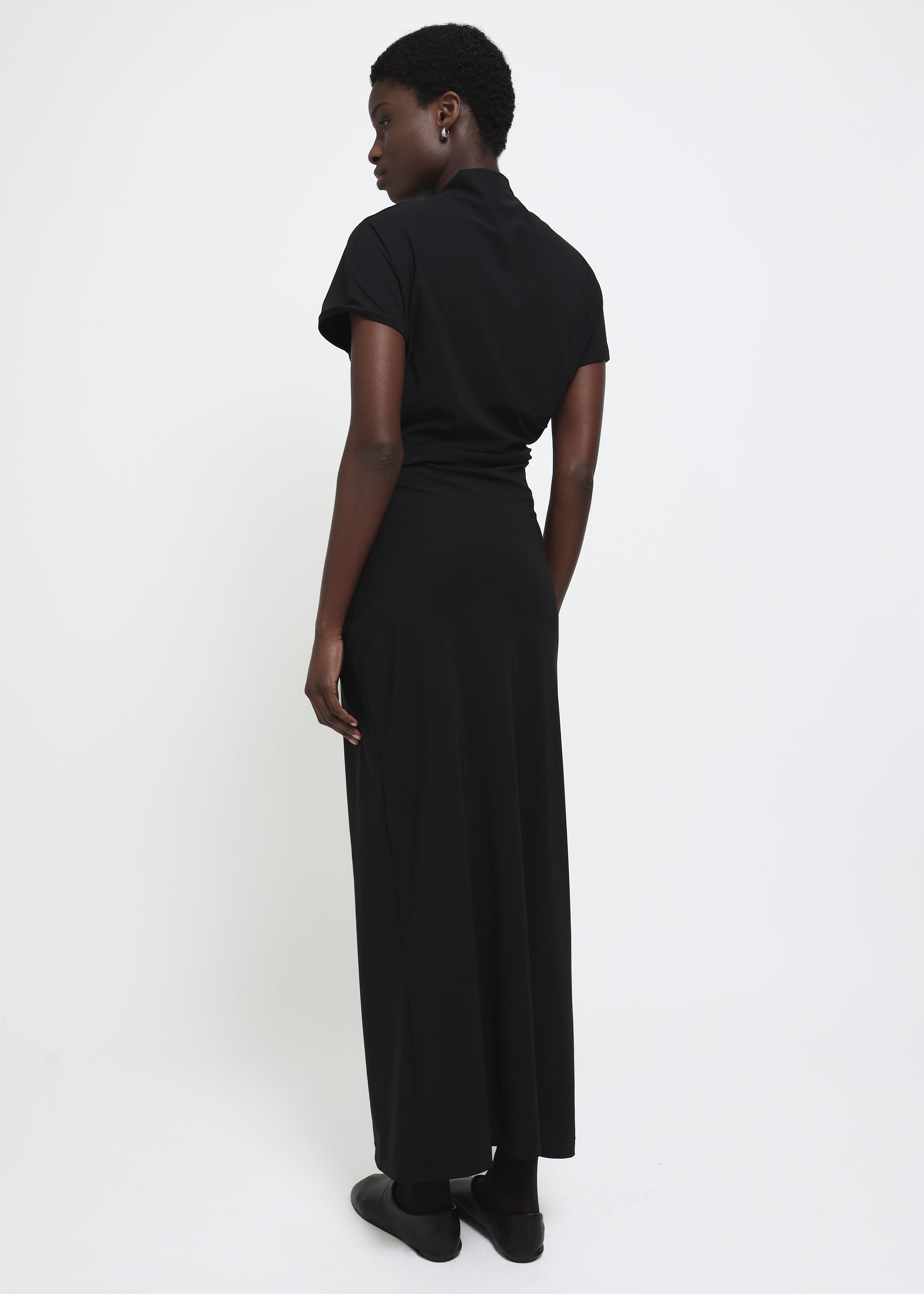 Black cap-sleeve ankle-length dress with a high mock neckline and soft waist folds