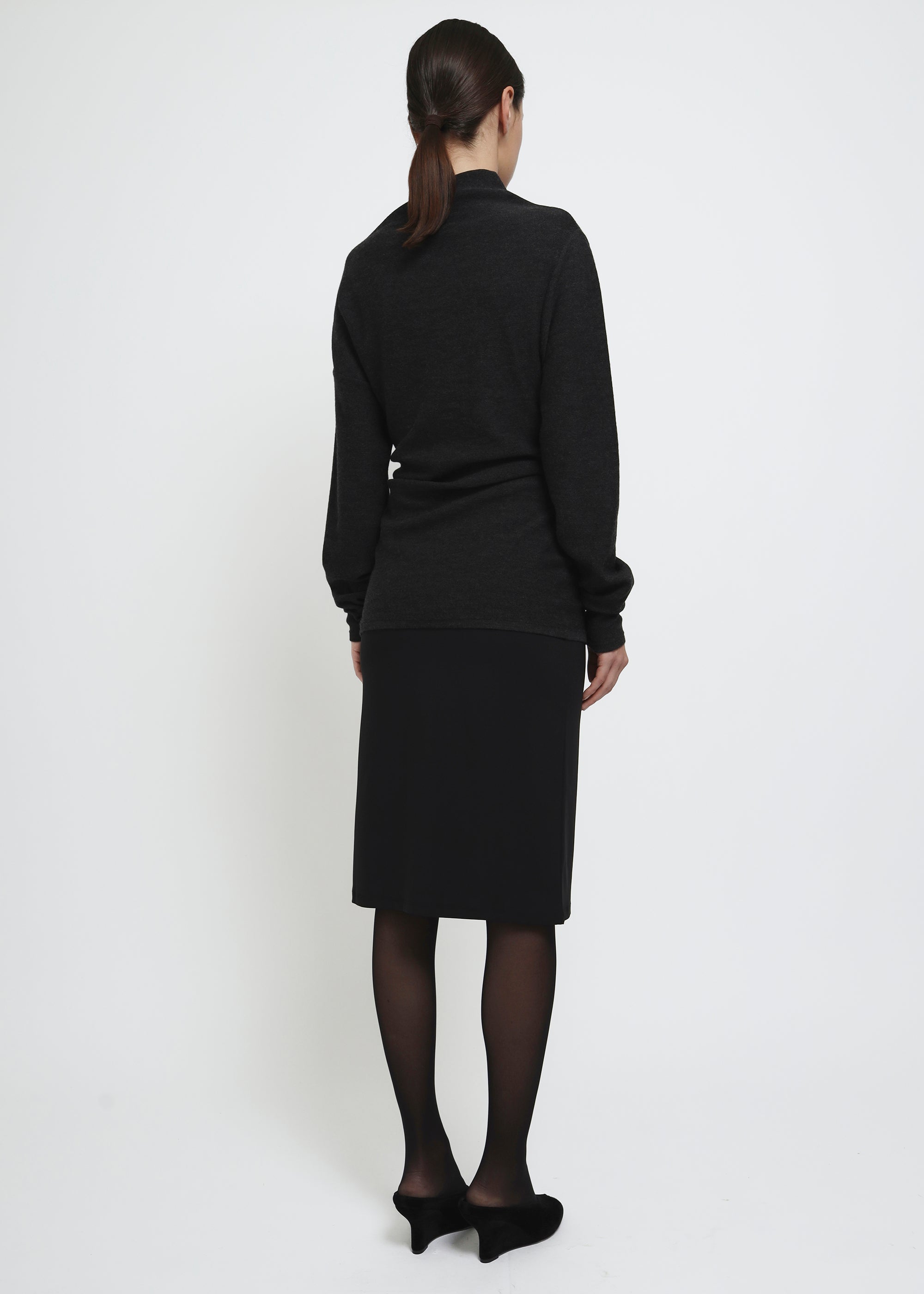 Black straight-fit midi skirt with a clean, minimal silhouette