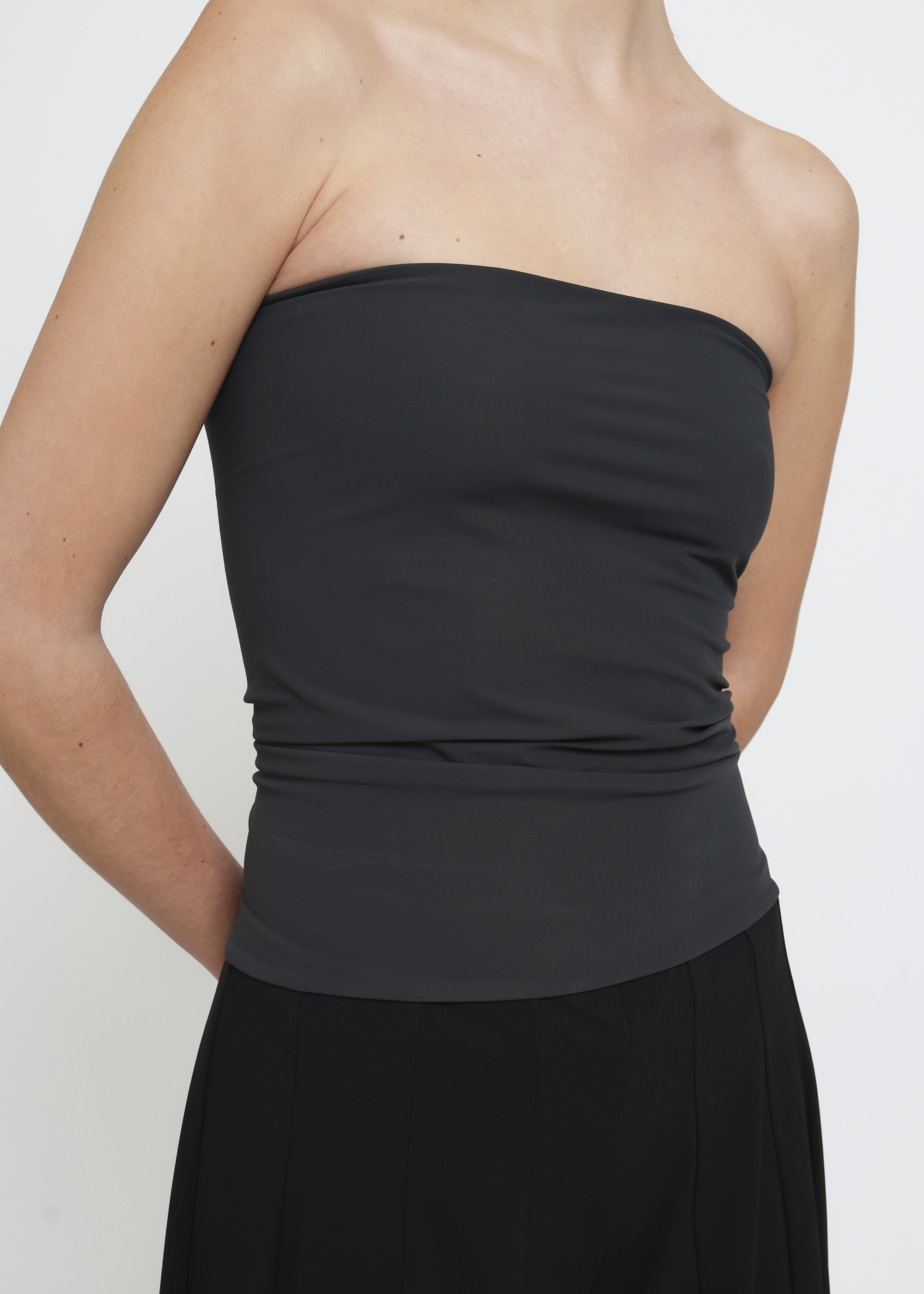 A dark gray strapless tube top.