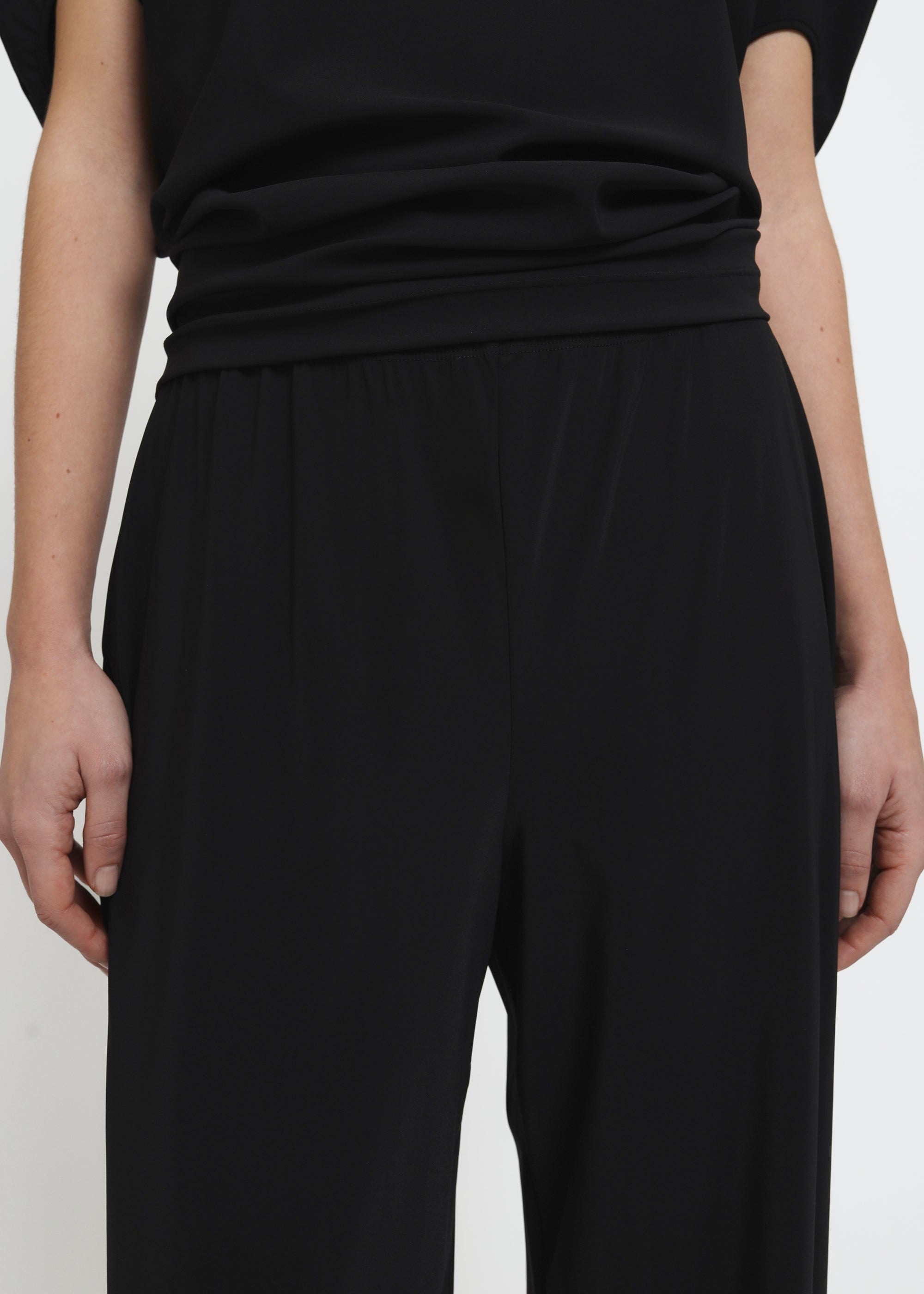 A black wide-leg pull on trousers.