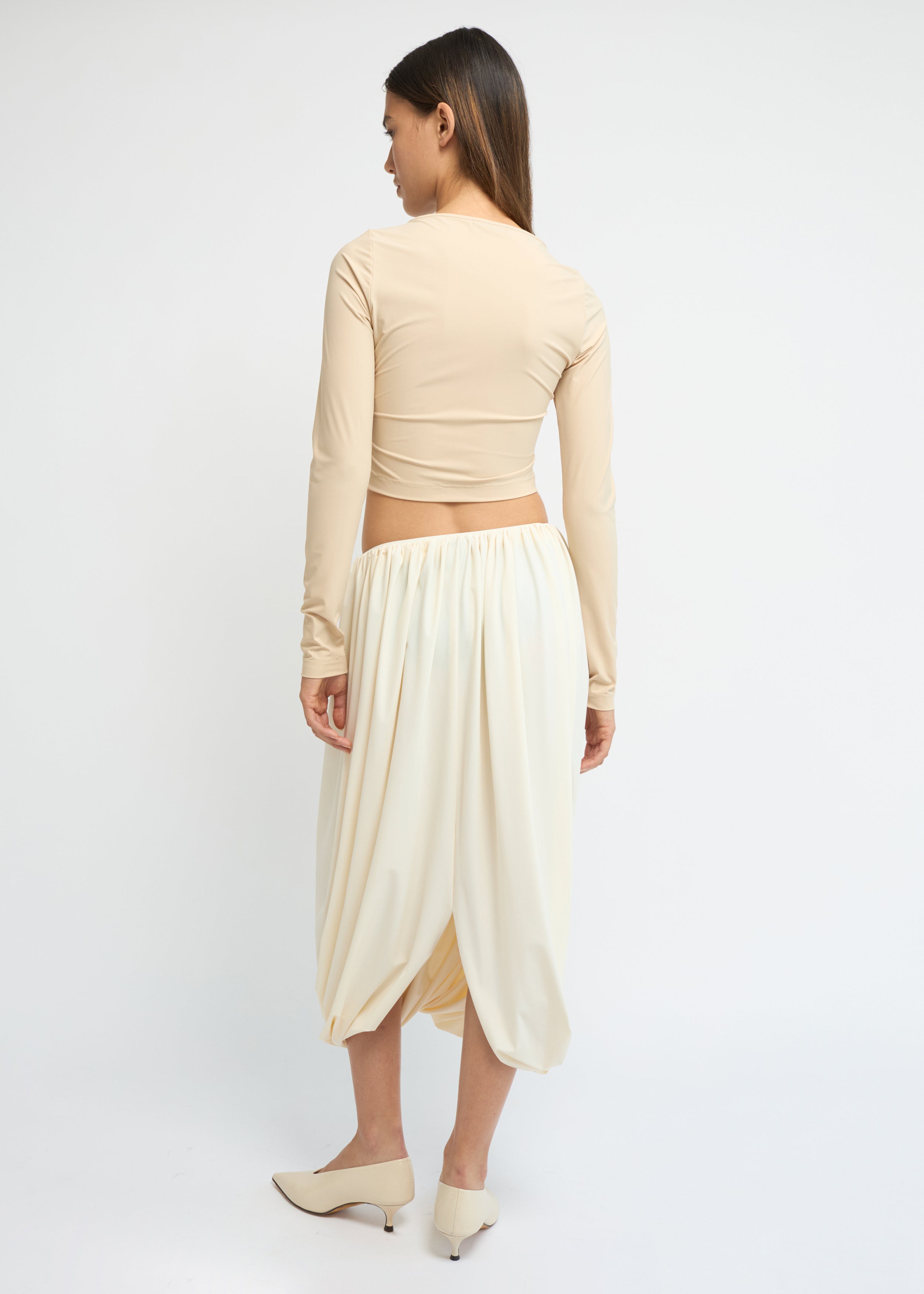 Cream balloon midi skirt with a voluminous, gathered silhouette