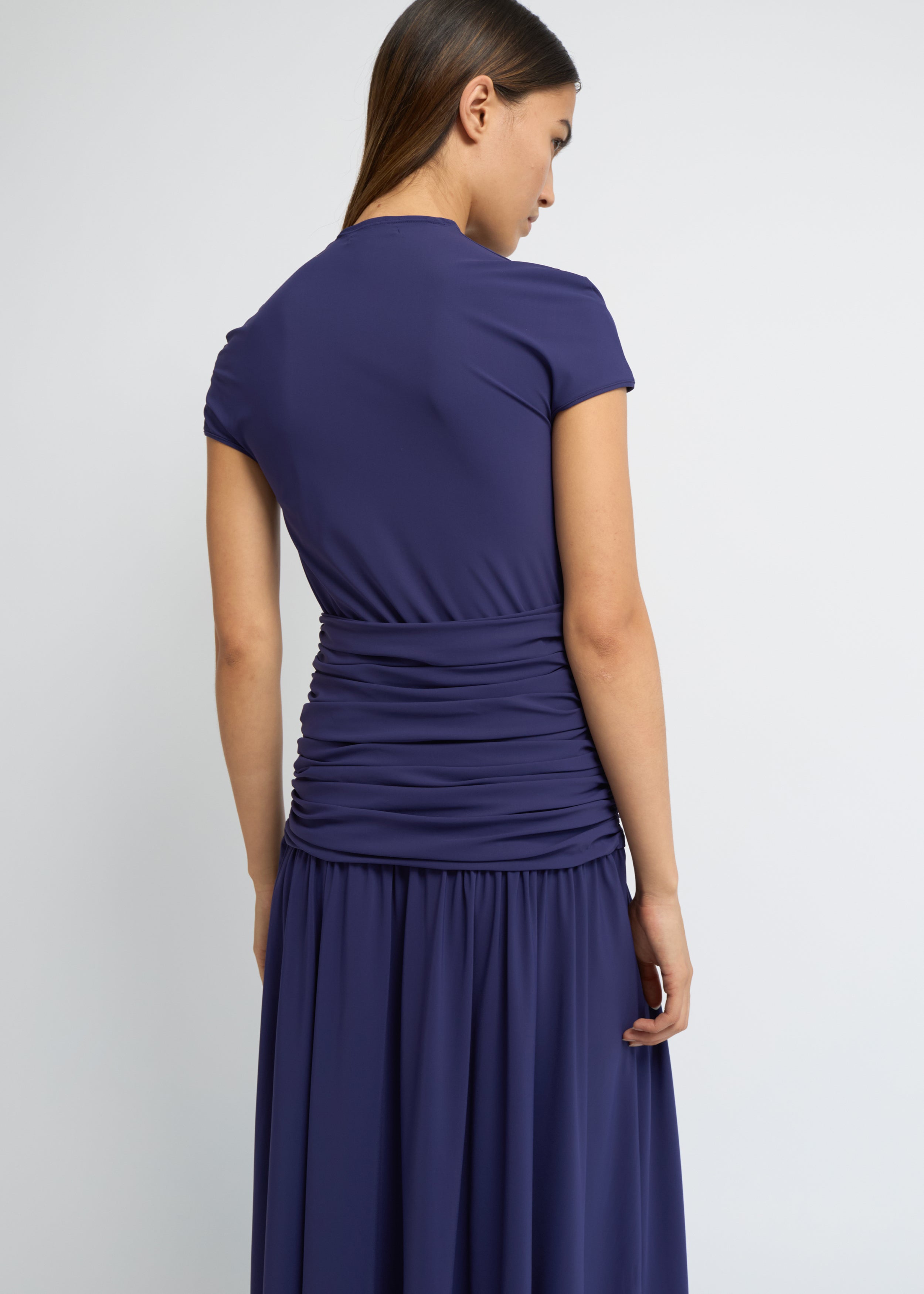 Violet ankle-length dress with cap sleeves, high neckline and softly gathered waist