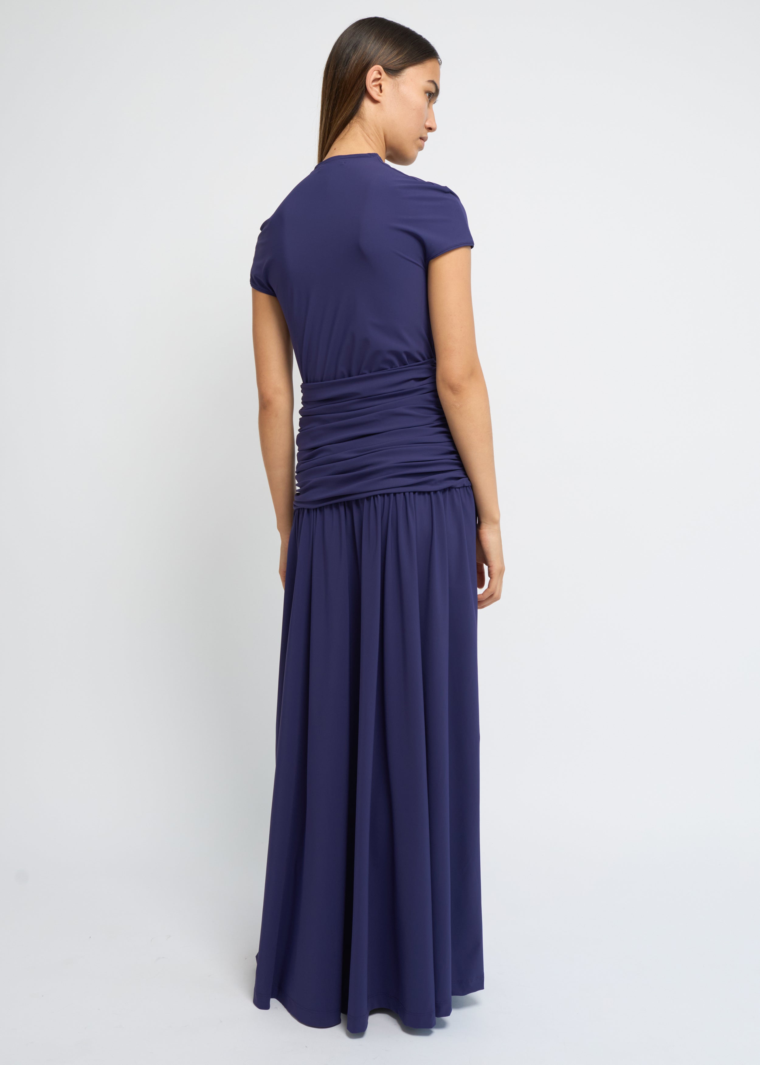 Violet ankle-length dress with cap sleeves, high neckline and softly gathered waist