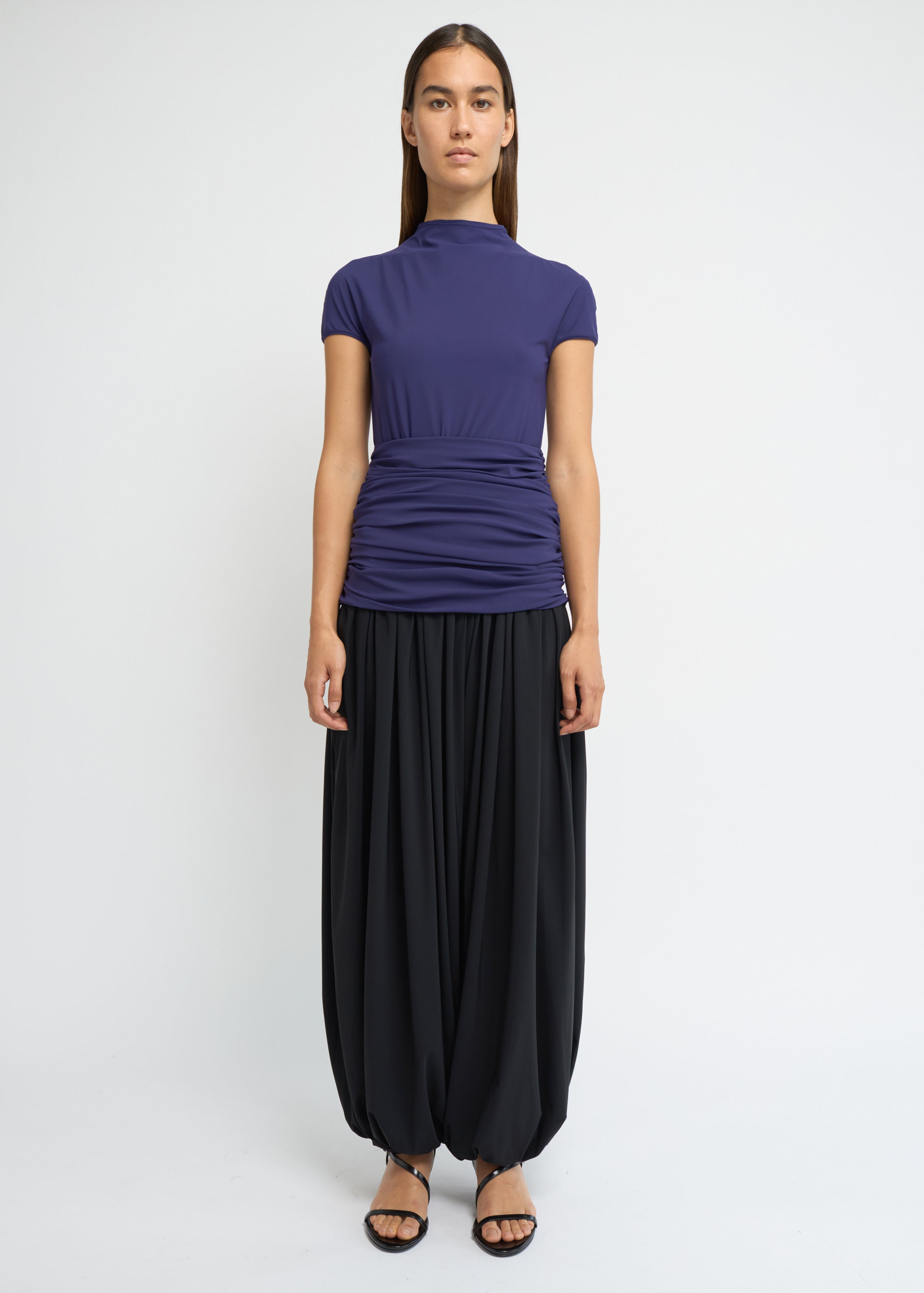 Violet fitted short-sleeve top with a high neckline and soft gathers at the waist