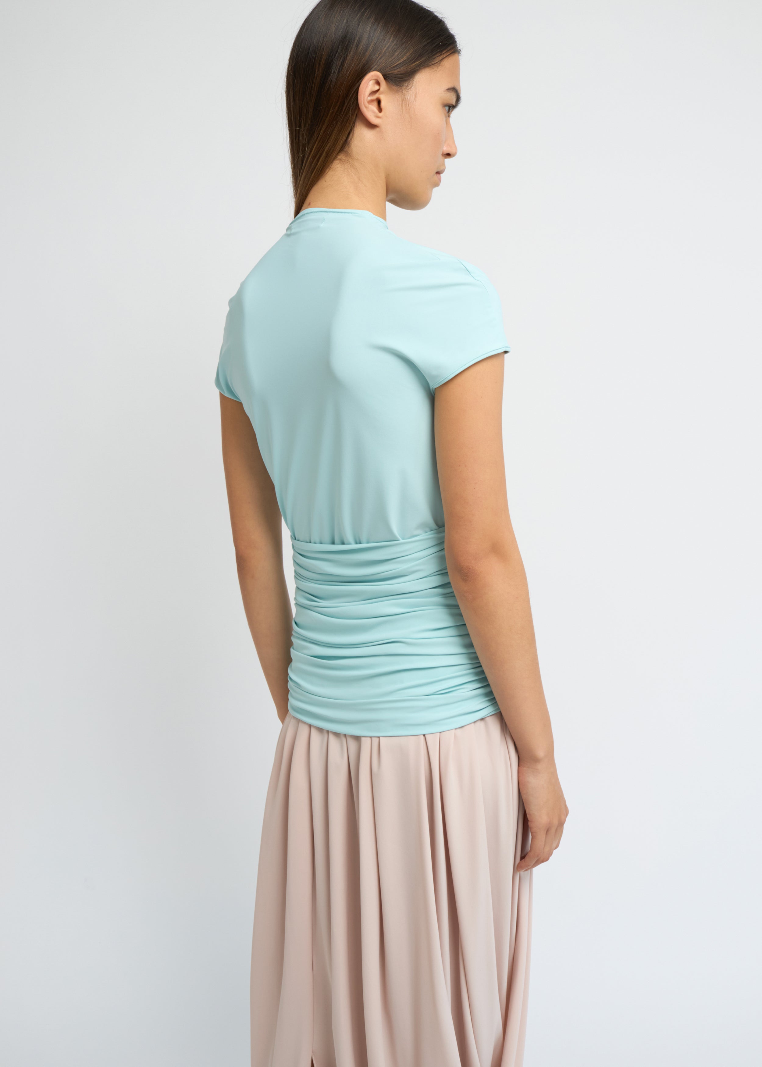 Sky fitted short-sleeve top with a high neckline and soft gathers at the waist