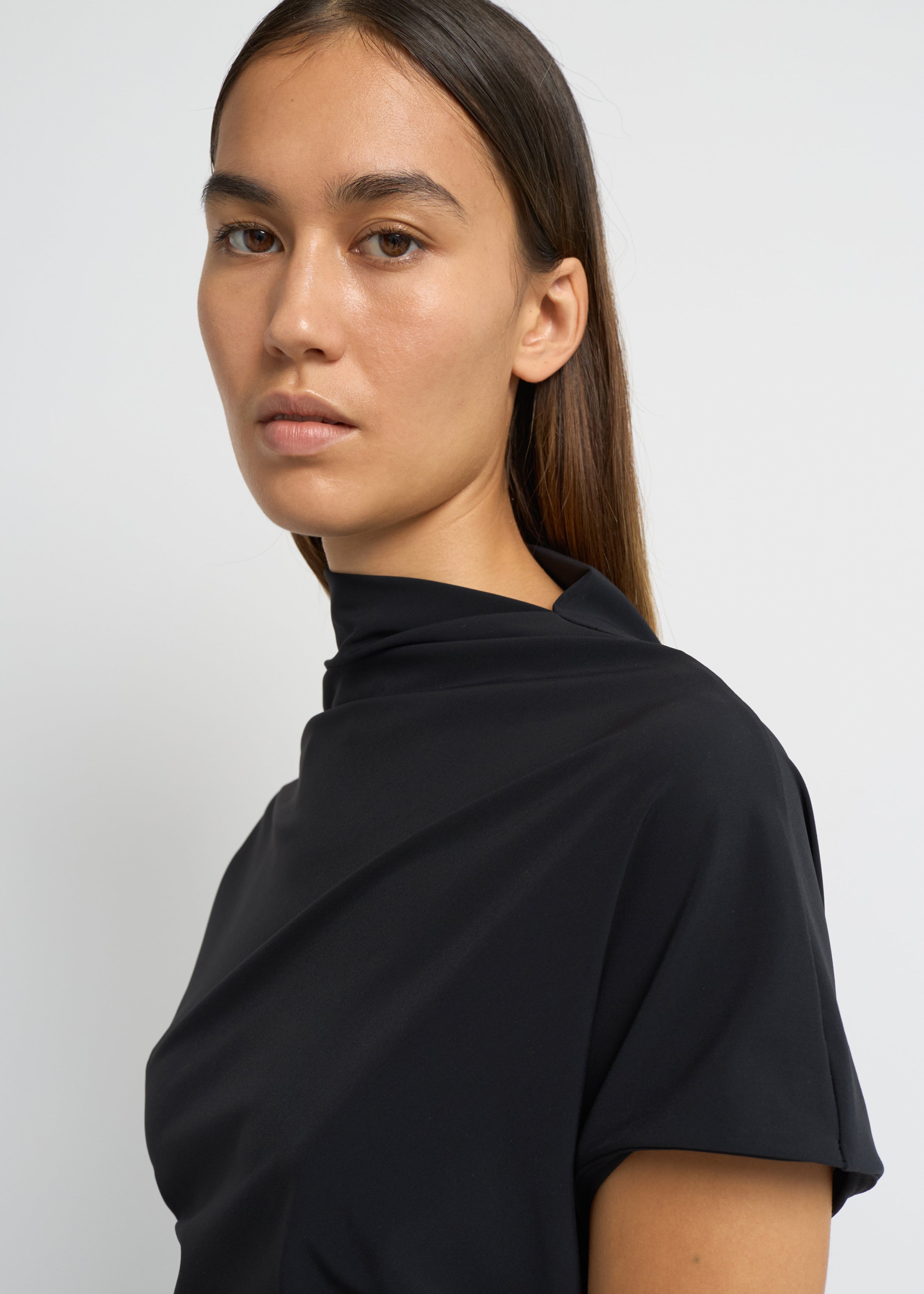 Black cap-sleeve ankle-length dress with a high mock neckline and soft waist folds