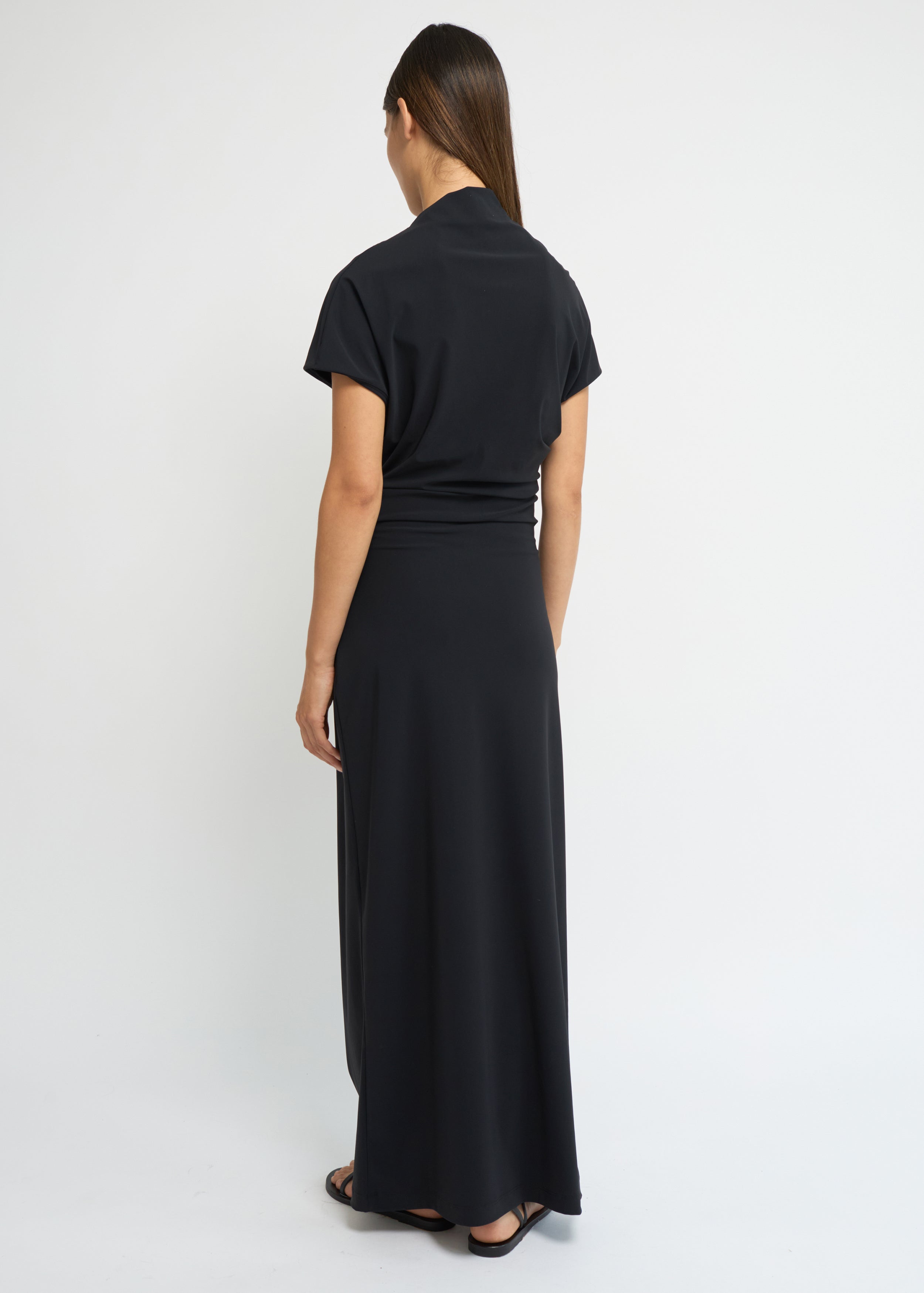 Black cap-sleeve ankle-length dress with a high mock neckline and soft waist folds