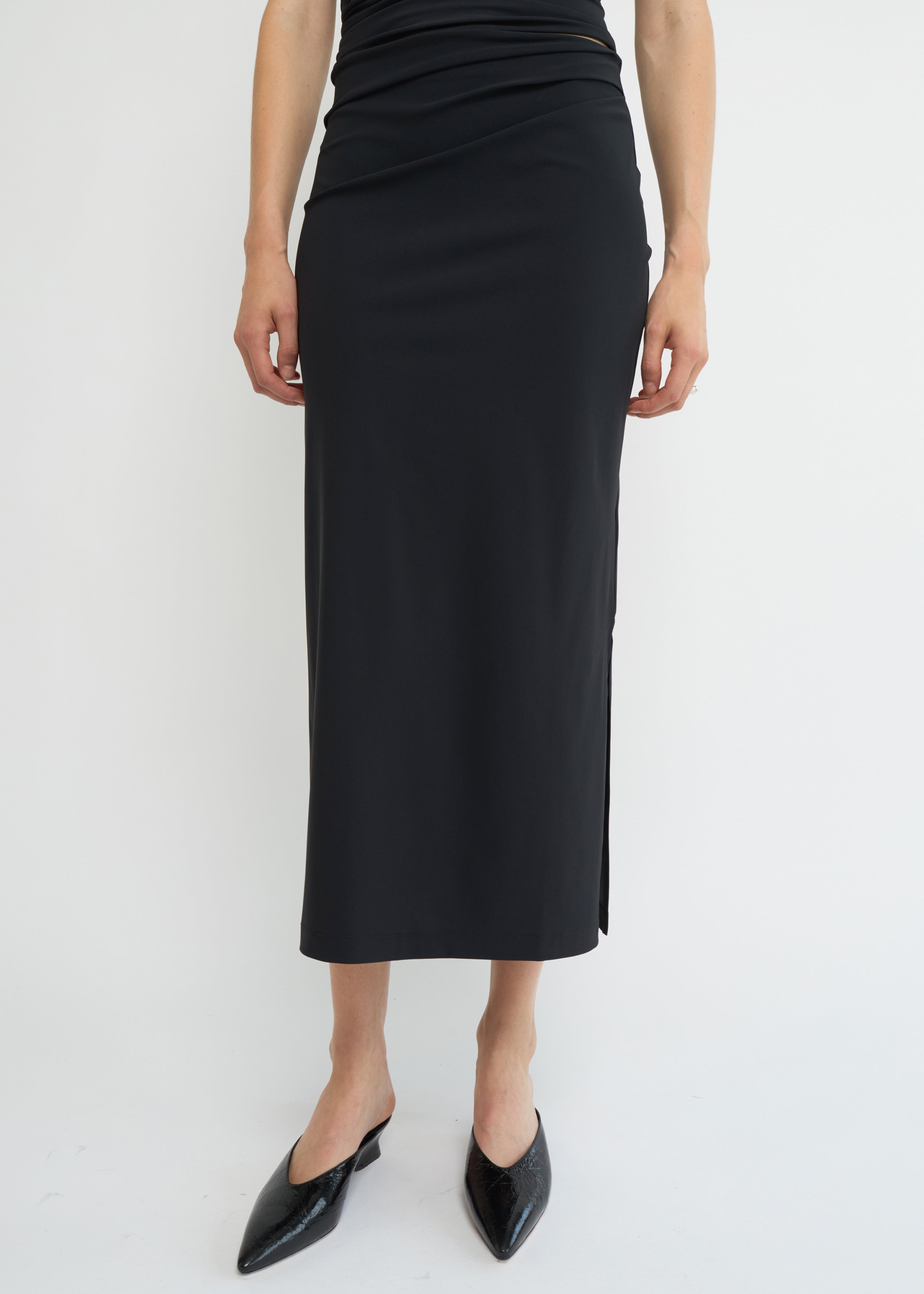 Black midi skirt with side split and straight silhouette