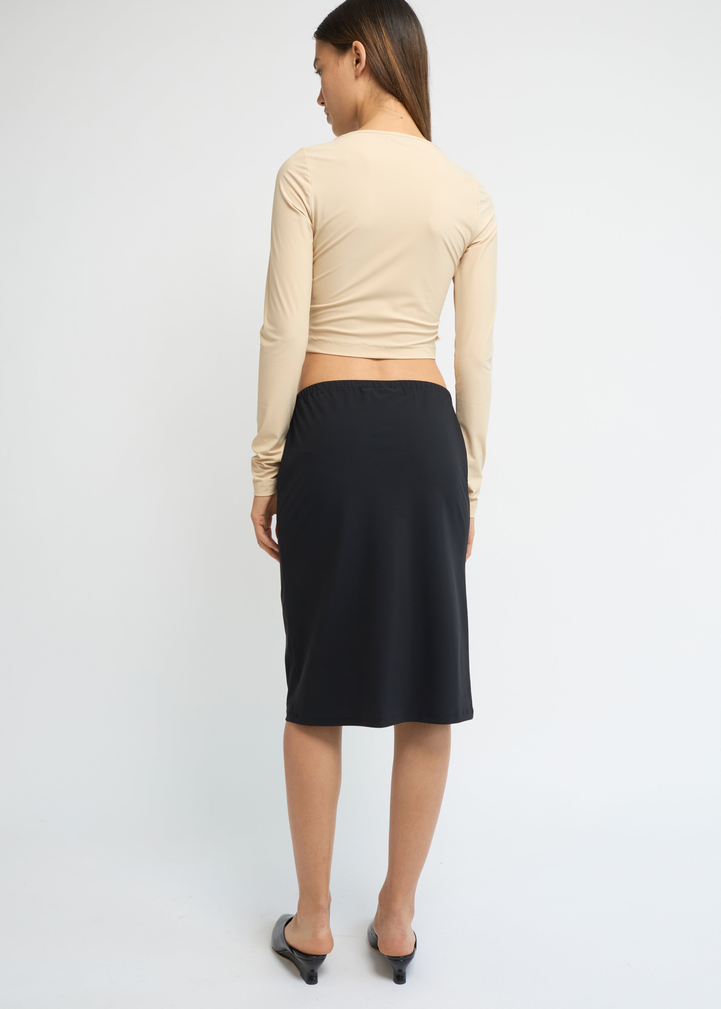 Black straight-fit midi skirt with a clean, minimal silhouette