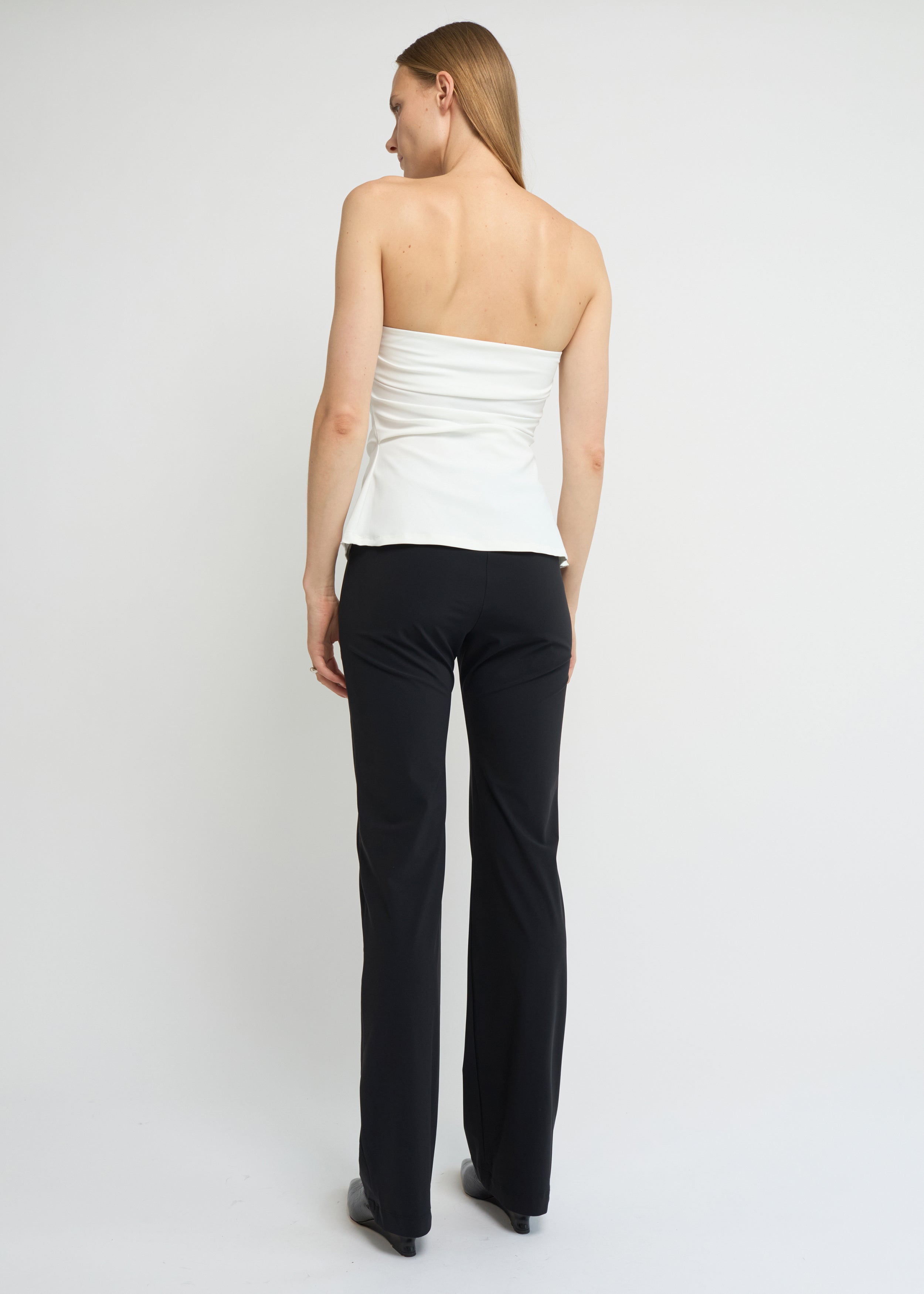 Off-white strapless A-line top with clean neckline and flared hem